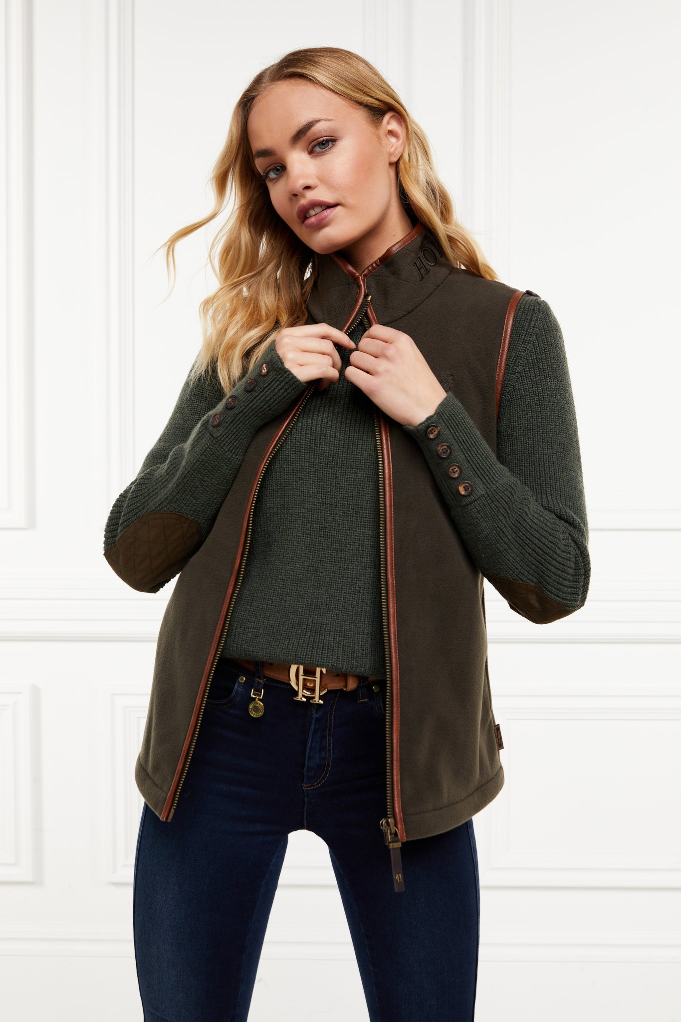 womens fleece gilet in khaki with tan leather piping around armholes neckline and down the front zip fastening