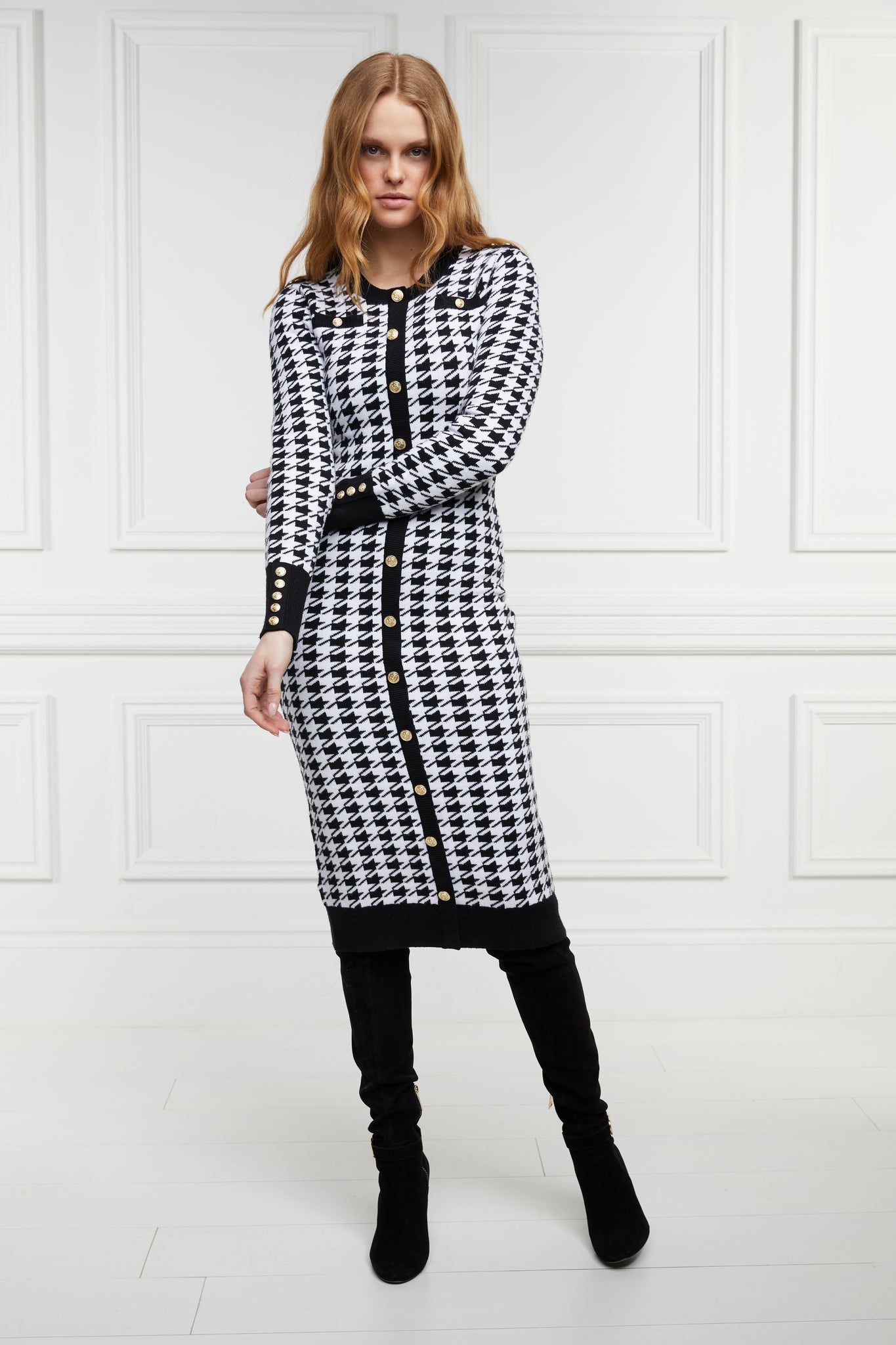 womens slim fit crew neck long sleeve knitted midi dress in white and black houndstooth with gold button detail on contrast black panel down the centre front and two black contrast welt pockets on chest and two on the hips with gold buttons on the centre of each and contrasting black ribbed hem neckline and cuffs
