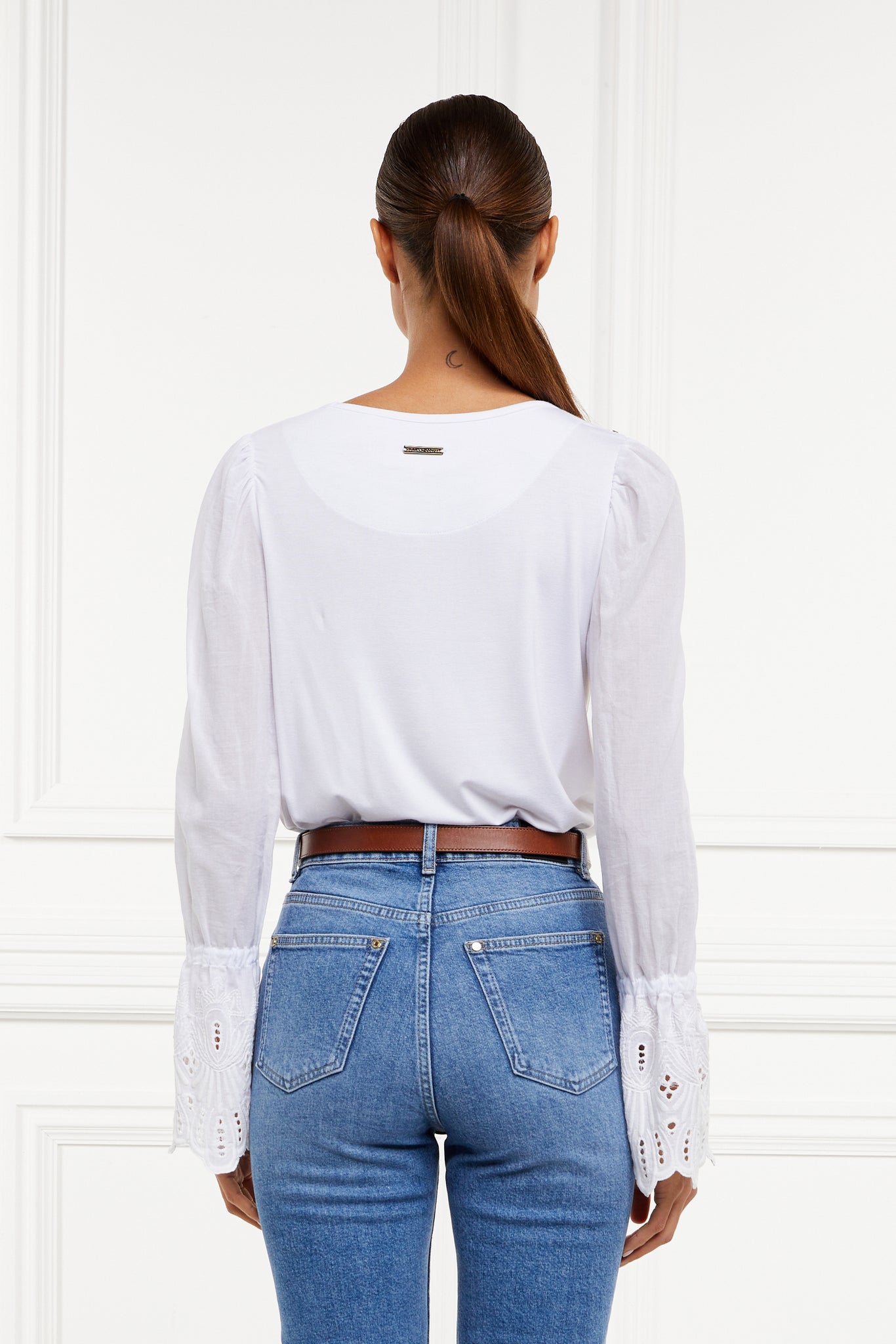 back image of Crew neck top with voluminous sleeves with gathered details at the shoulder and broderie detailing above the cuff and detailed with Holland Cooper rivets on the shoulders and subtle gold placket on the balk yolk