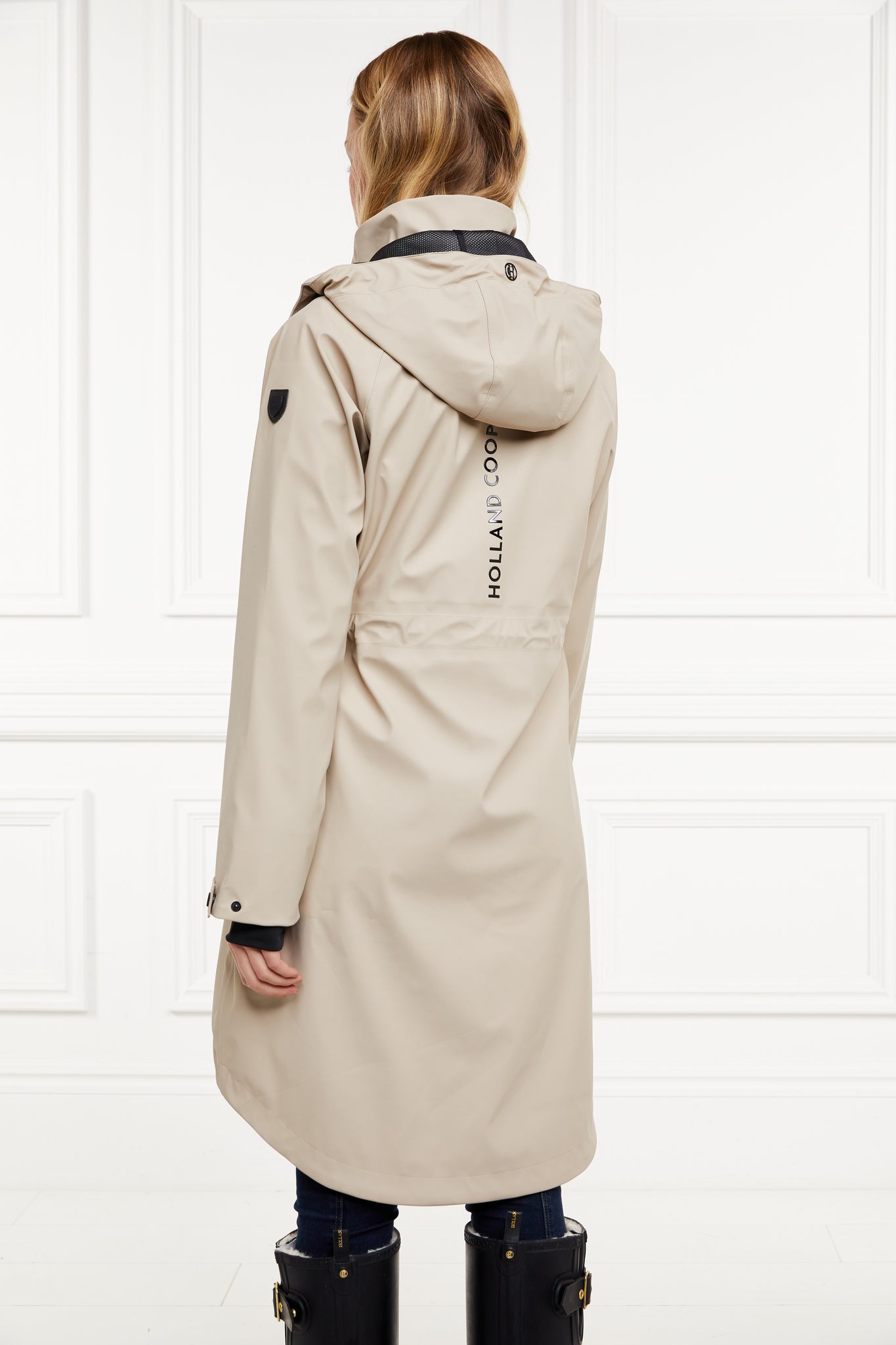 back of womens stone rain coat with hood 