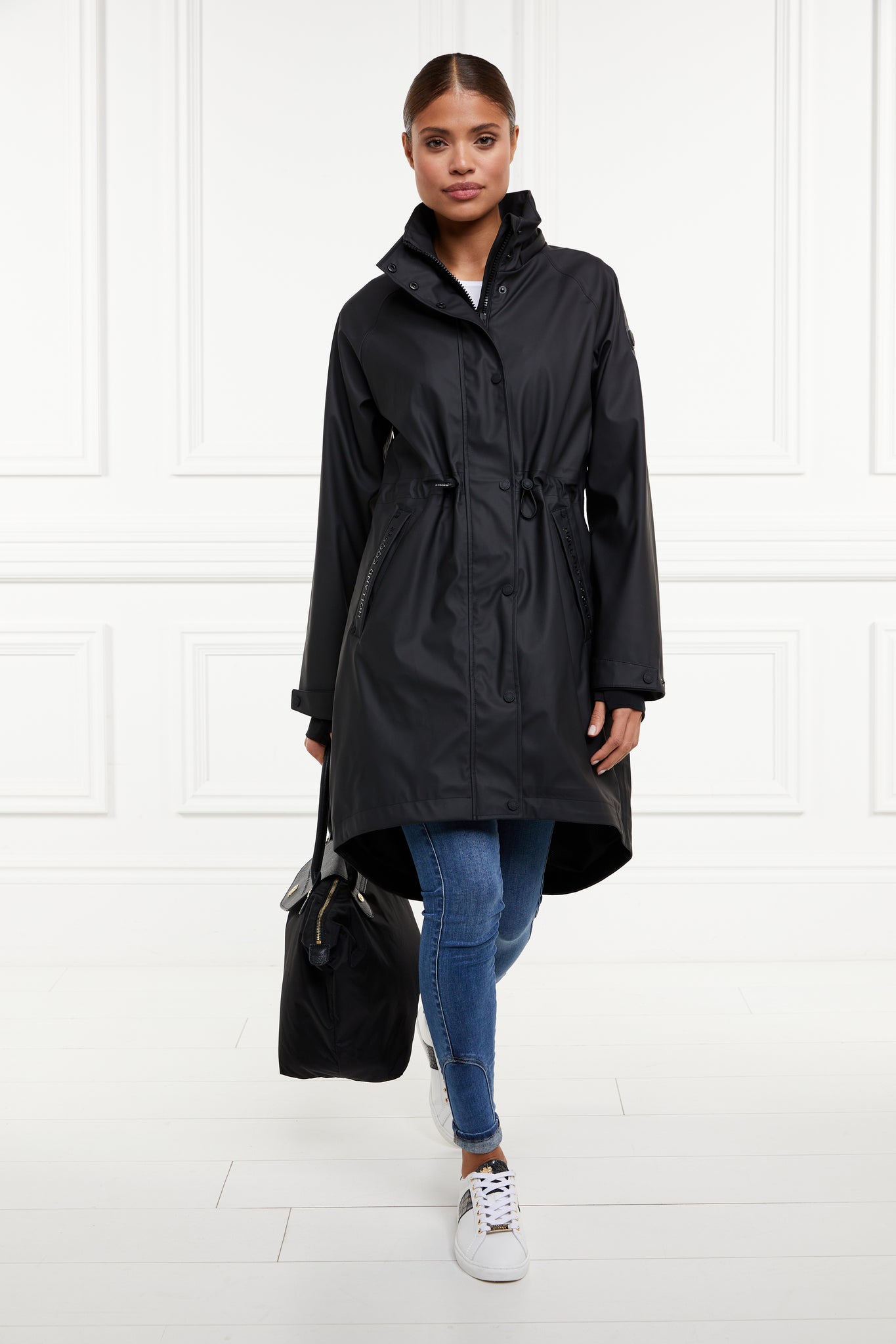 womens black hooded rain coat with black hardware 