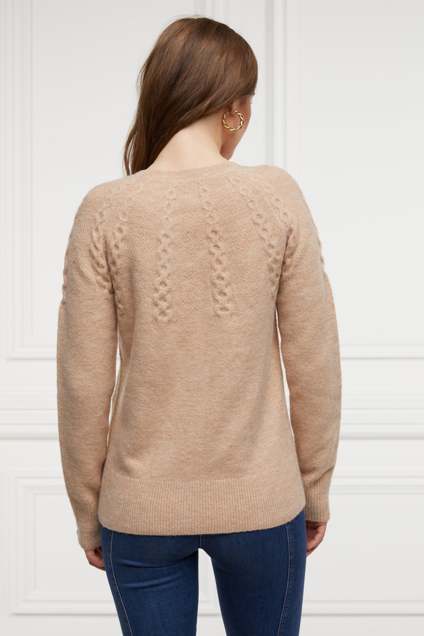 back of womens chunky knit crew neck jumper in camel with half cable knit knit detailing and horn buttons across cuffs 
