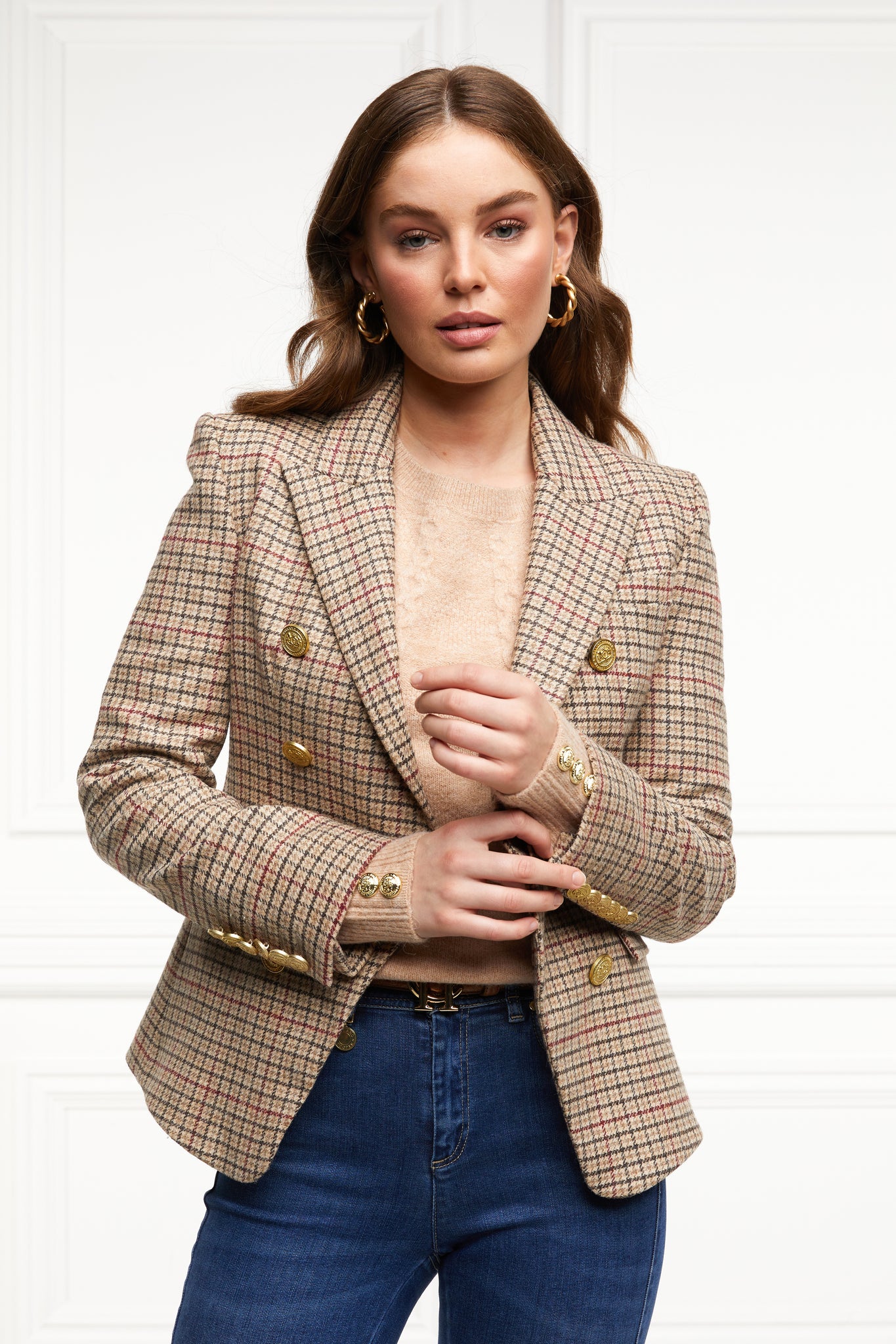 British made double breasted blazer that fastens with a single button hole to create a more form fitting silhouette with two pockets and gold button detailing this blazer is made from camel black and red check charlton tweed