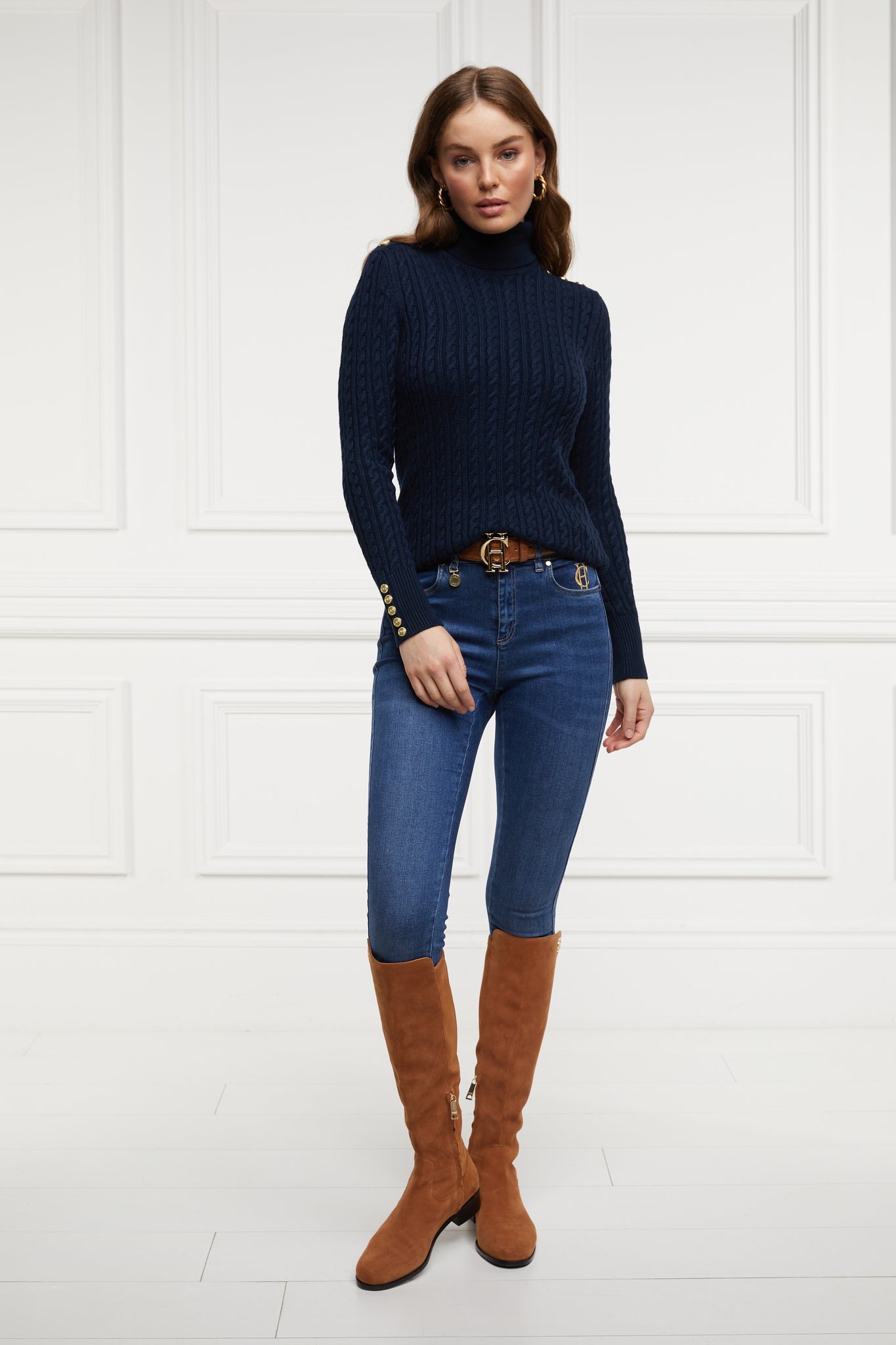 womens cable knit jumper in navy with ribbed roll neck cuffs and hem