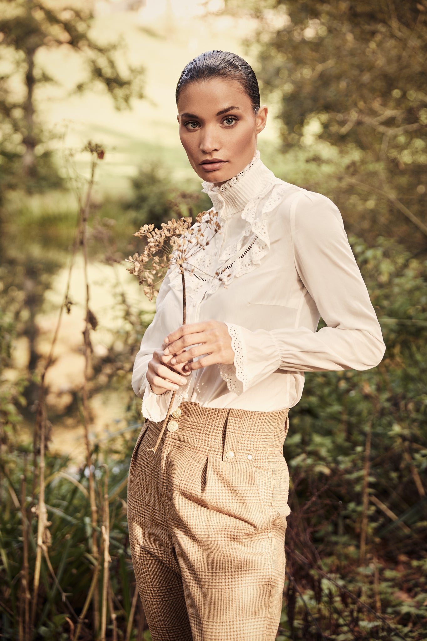 White blouse with long sleeves and a slim fit with delicate lace trim to both the collar and cuff edges with flattering lace details to the front body 