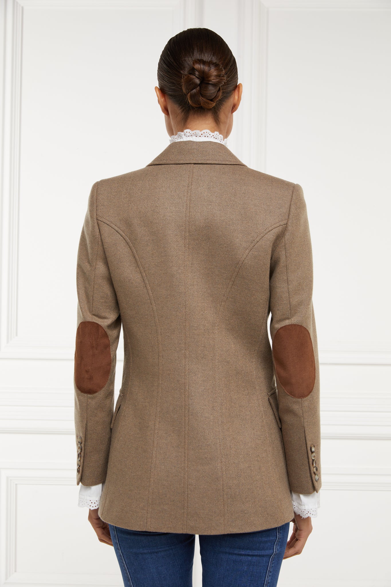 back of womens tailored fit single breasted blazer in camel herringbone with patch pockets and contrast tan suede elbow patches and underside collar