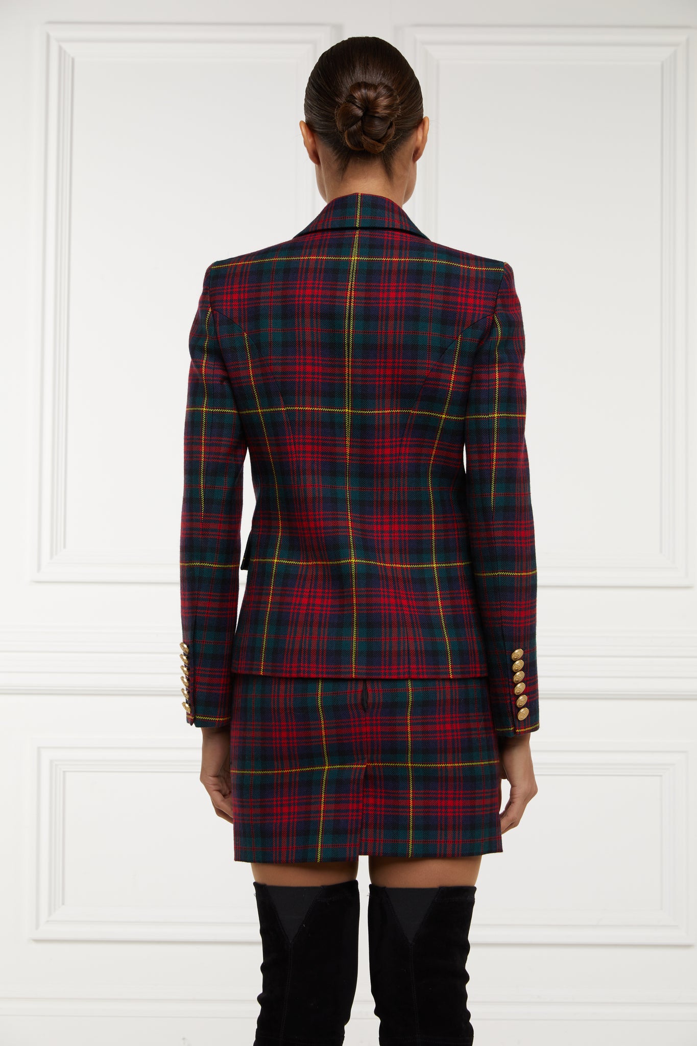 back of British made double breasted blazer that fastens with a single button hole to create a more form fitting silhouette with two pockets and gold button detailing this blazer is made from  red green navy and yellow logan tartan