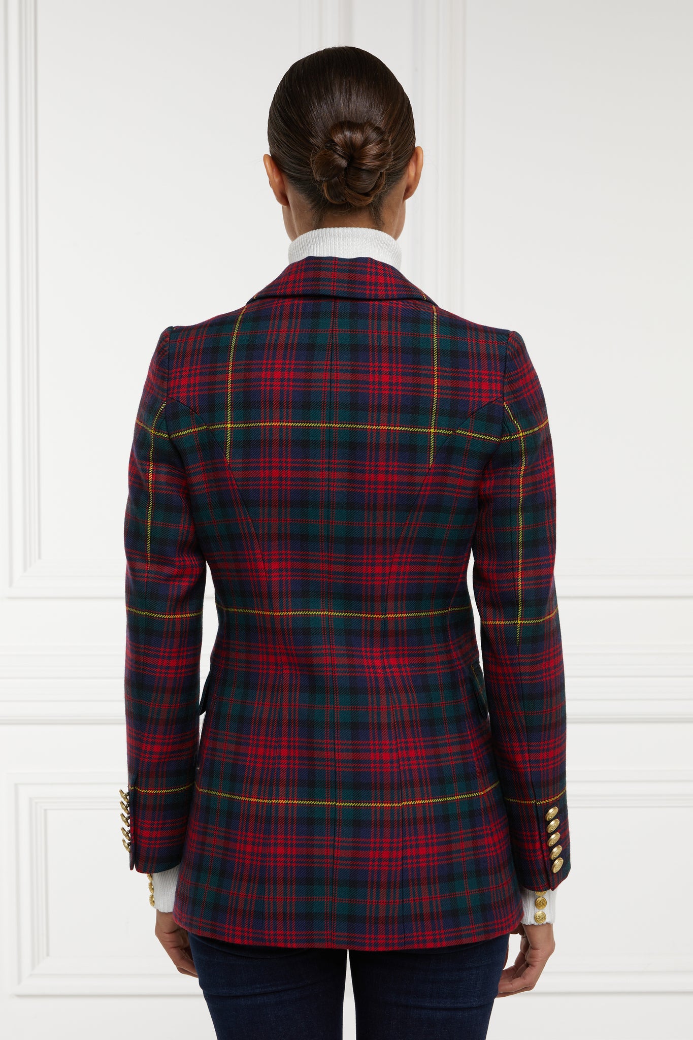 back of double breasted wool blazer in dark red navy green and yellow logan tartan with two hip pockets and gold button details down front and on cuffs and handmade in the uk