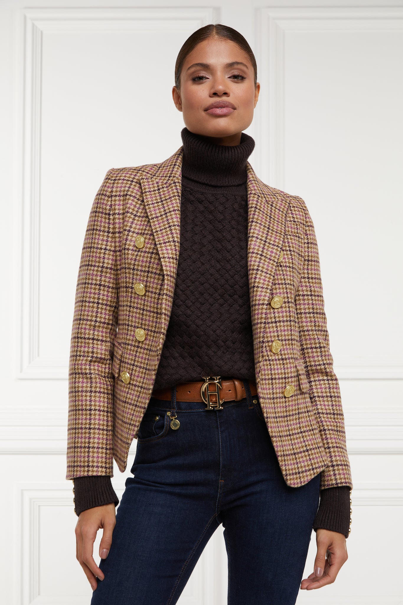 British made double breasted blazer that fastens with a single button hole to create a more form fitting silhouette with two pockets and gold button detailing this blazer is made from pink purple and brown check houndstooth fabric