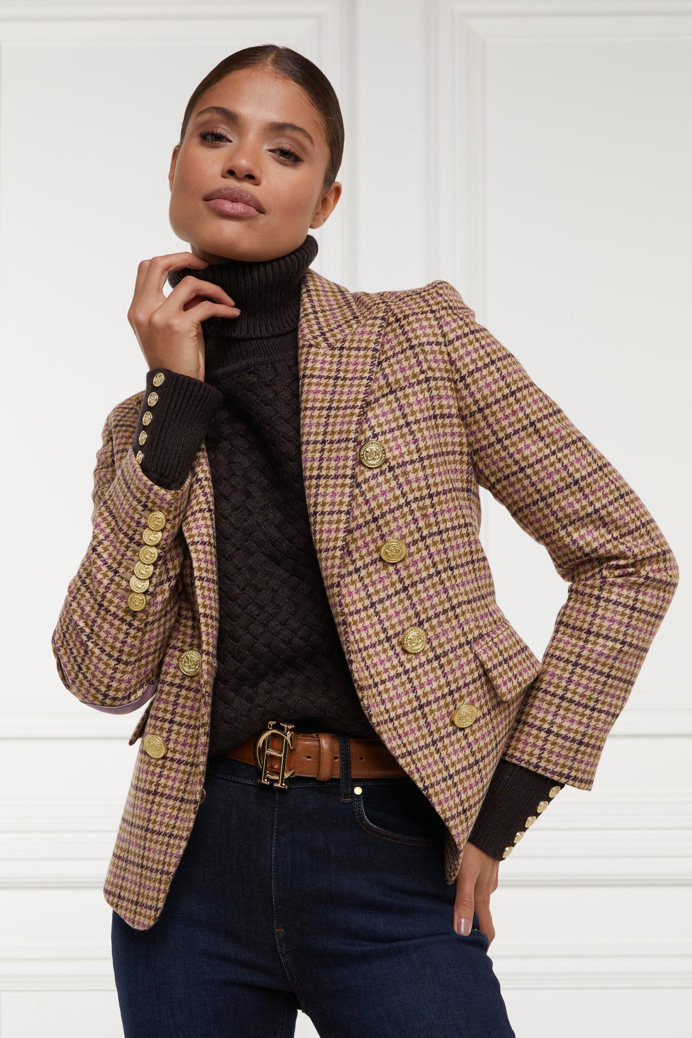 British made double breasted blazer that fastens with a single button hole to create a more form fitting silhouette with two pockets and gold button detailing this blazer is made from pink purple and brown check houndstooth fabric