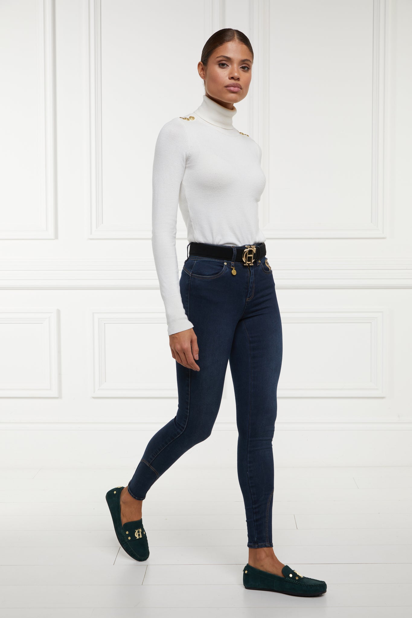 womens high rise dark blue denim skinny stretch jean with jodhpur style seam and two open pockets to the front with hc embroidery on front left pocket