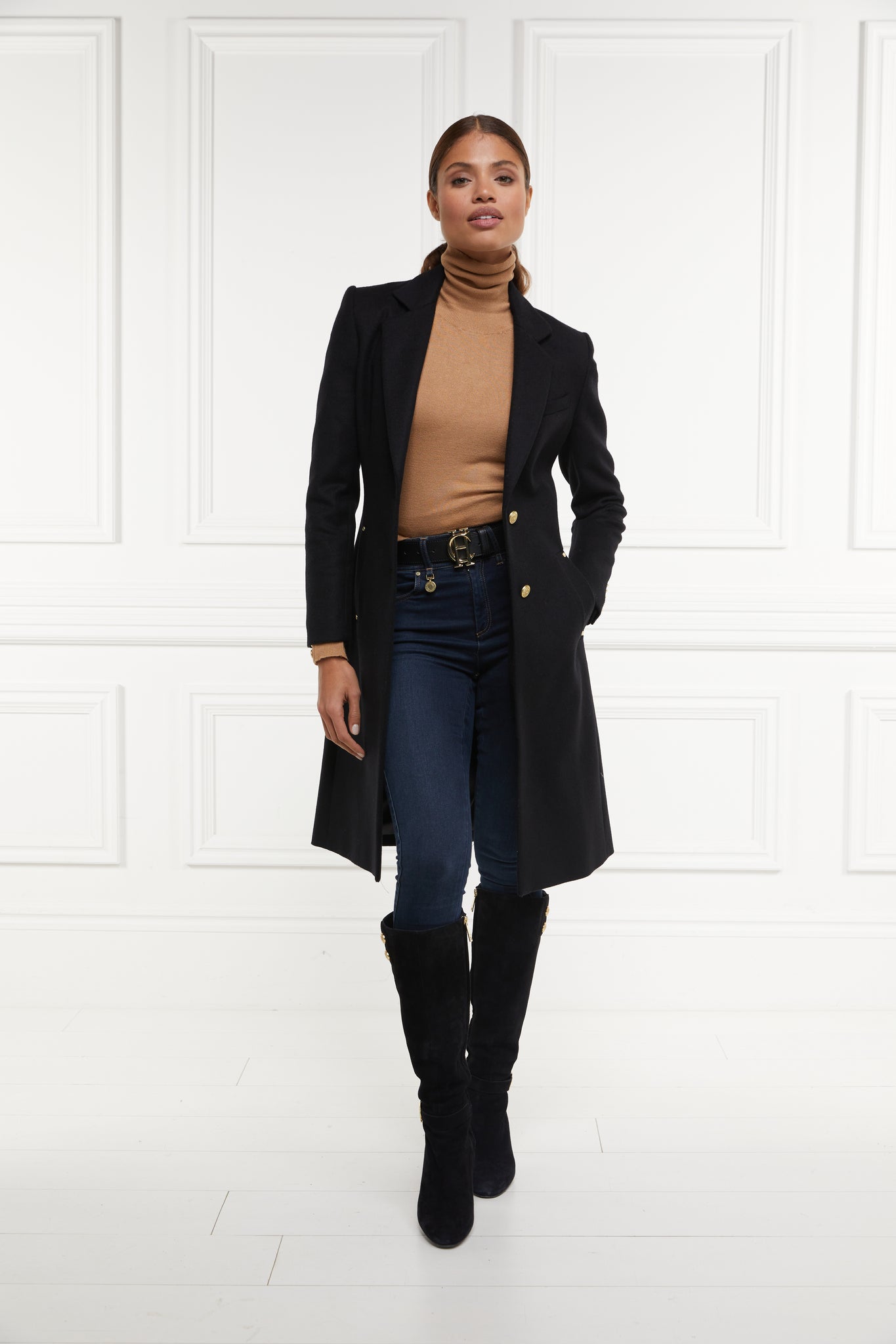 womens black wool knee length single breasted coat detailed with gold hardware