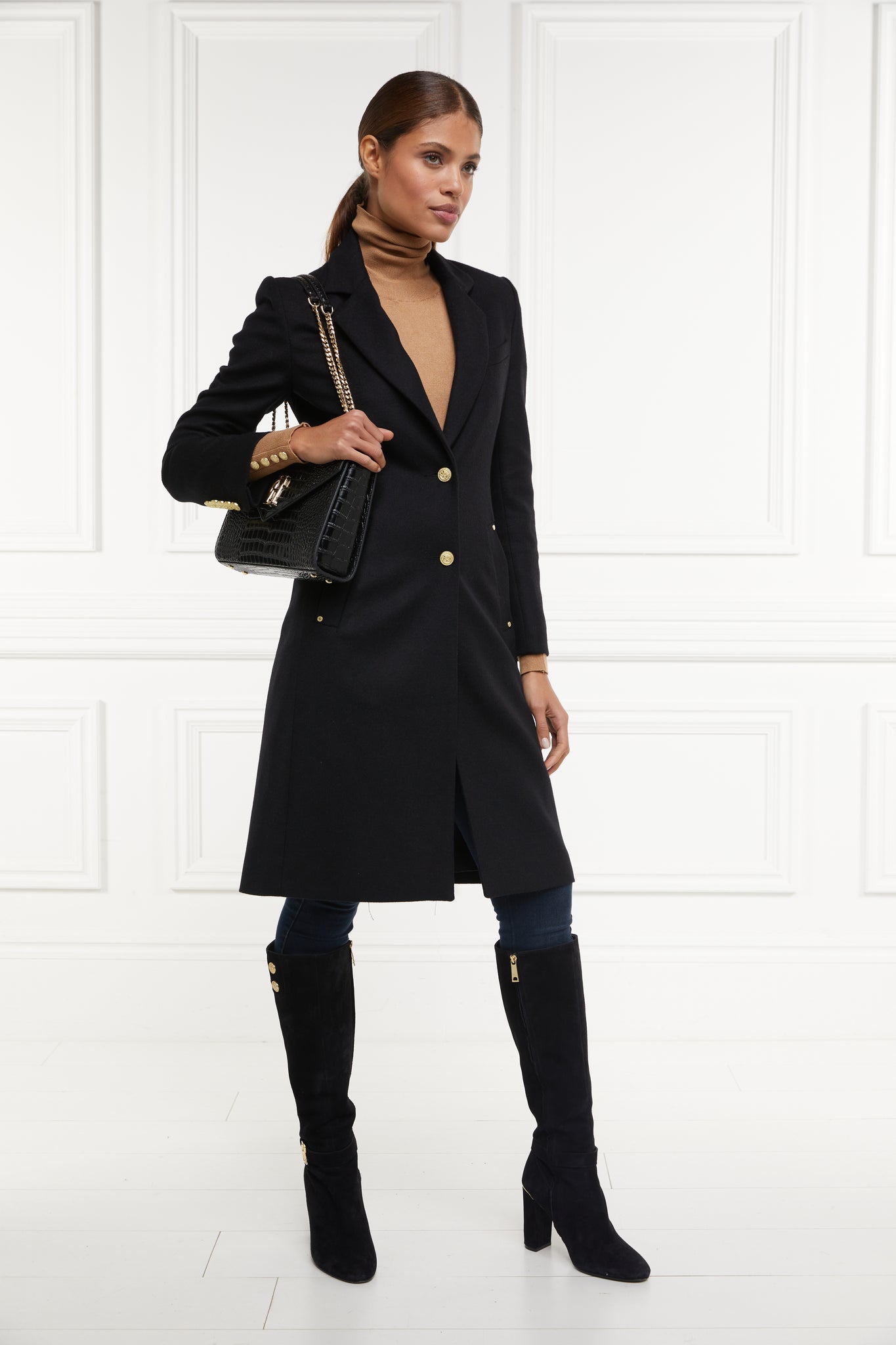 womens black wool knee length single breasted coat detailed with gold hardware