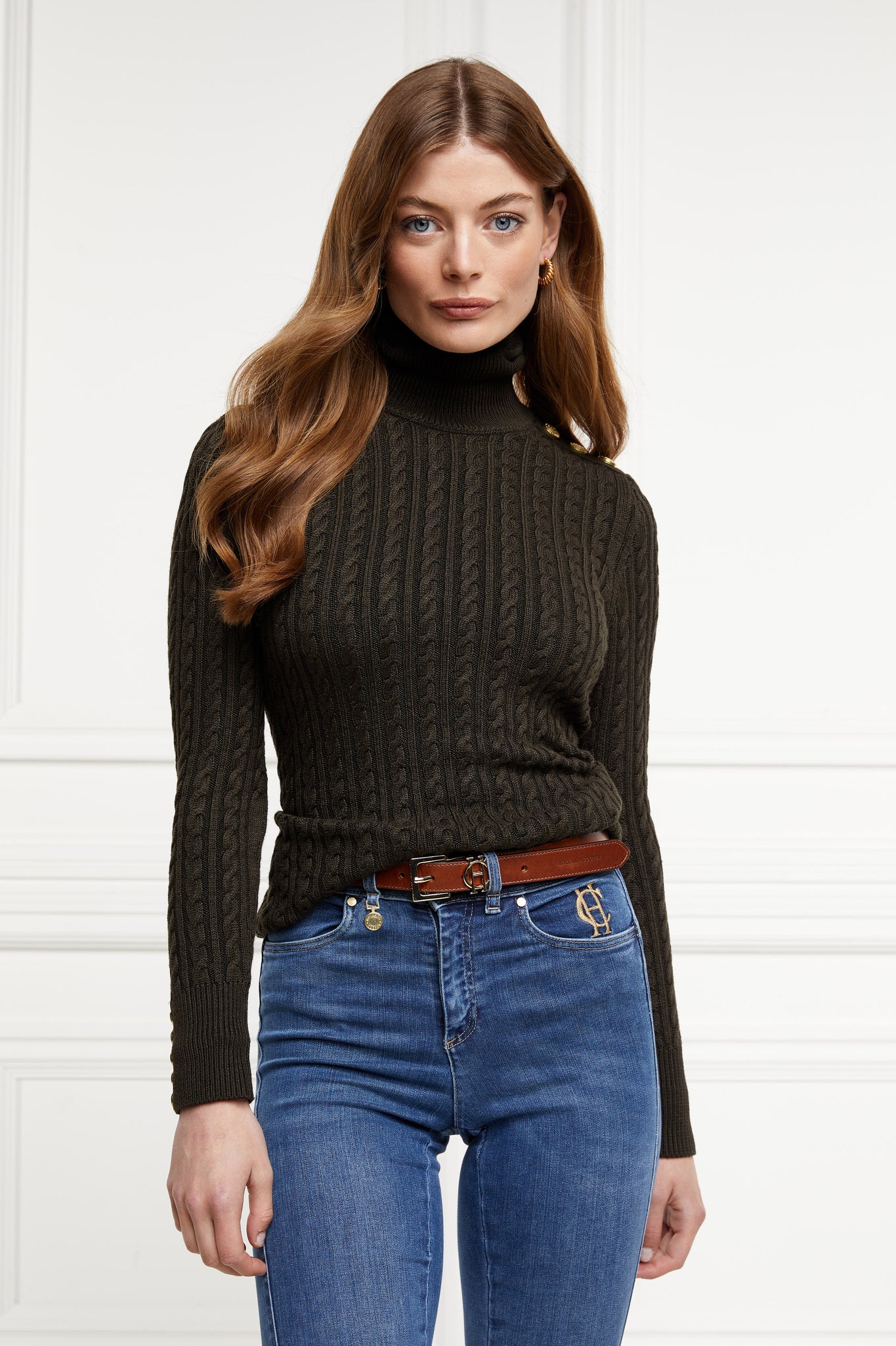 womens cable knit jumper in fern green with ribbed roll neck cuffs and hem