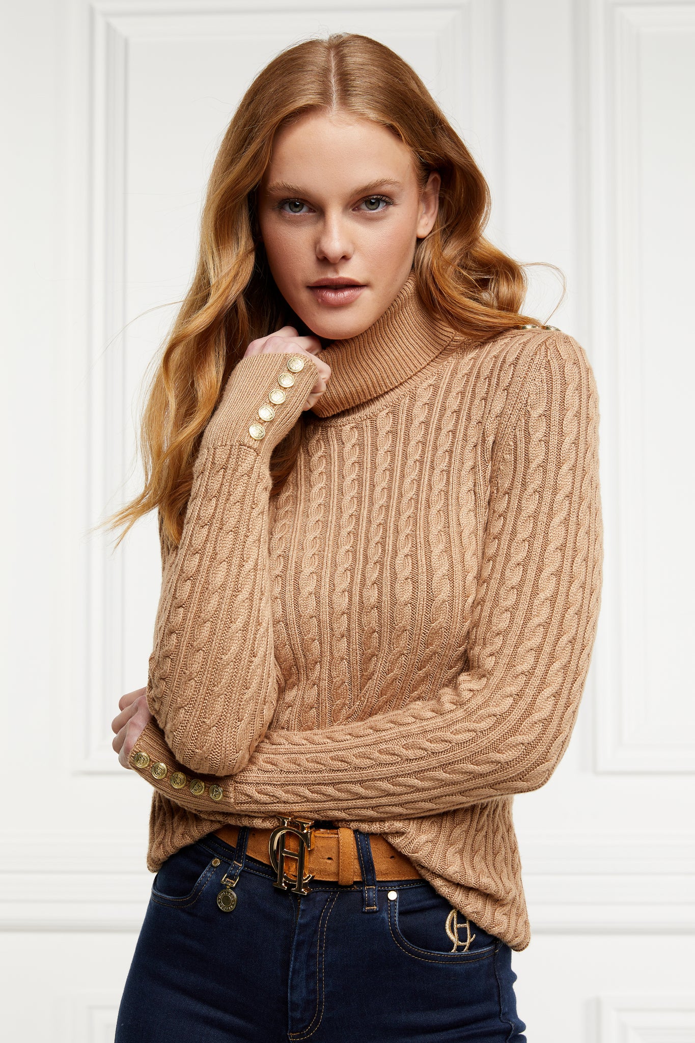 womens cable knit jumper in dark camel with ribbed roll neck cuffs and hem