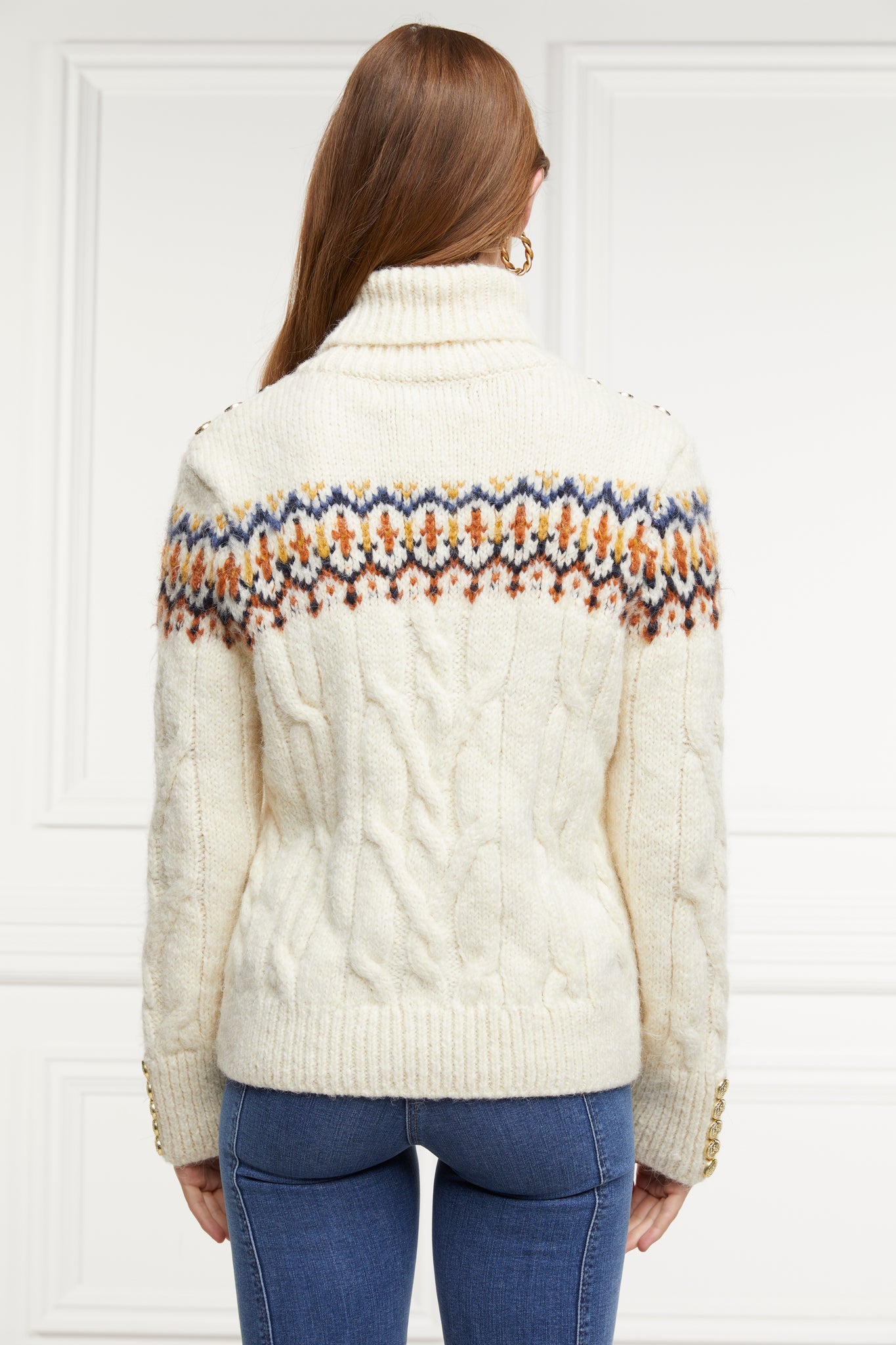 high roll neck cable knit jumper in cream with a blue orange and yellow fairisle knit detail across the chest around the upper arm and back