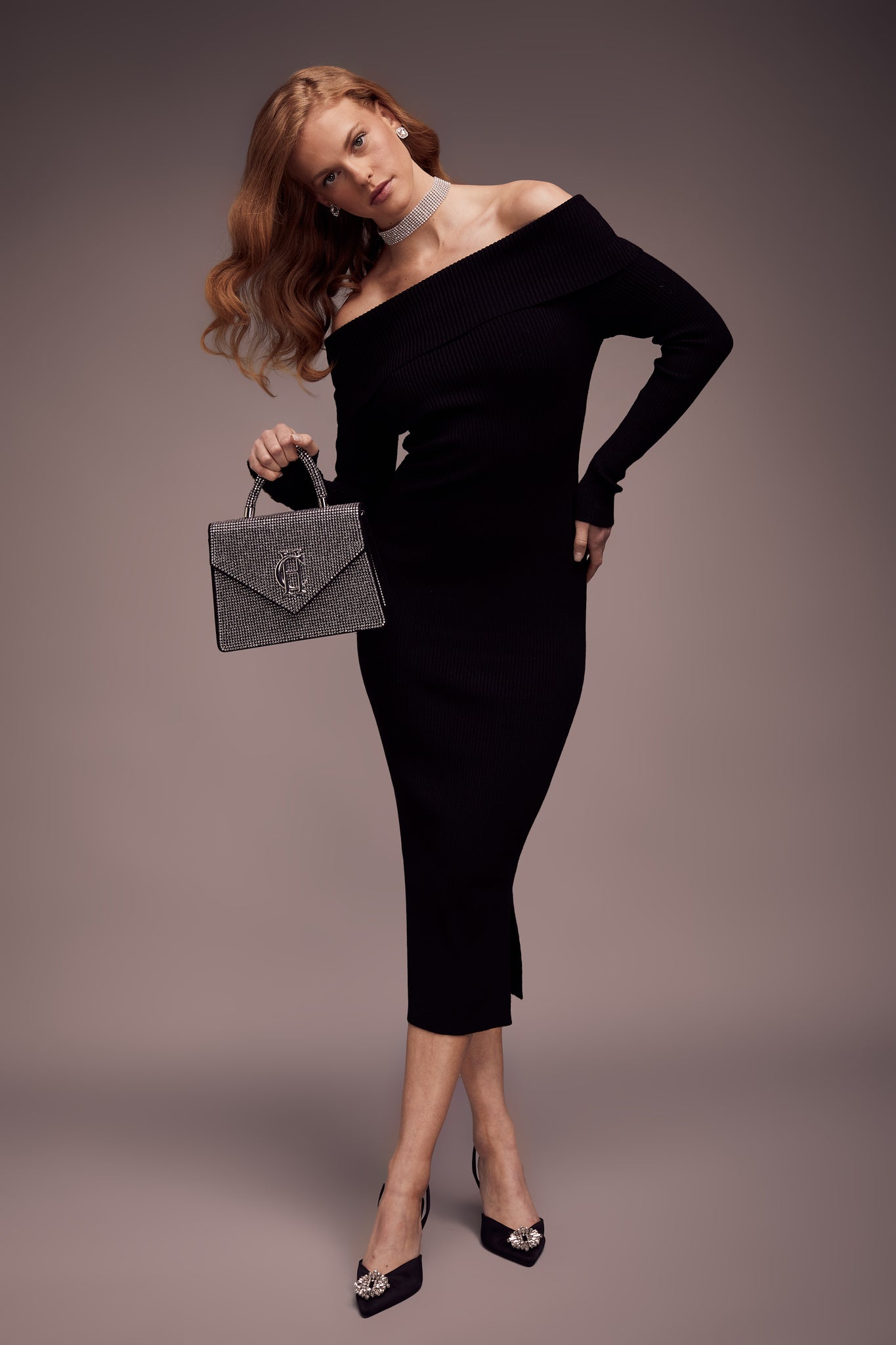 womens black long sleeved ribbed knitted bardot midi dress with gold buttons on cuffs with silver diamante rhinestone bag