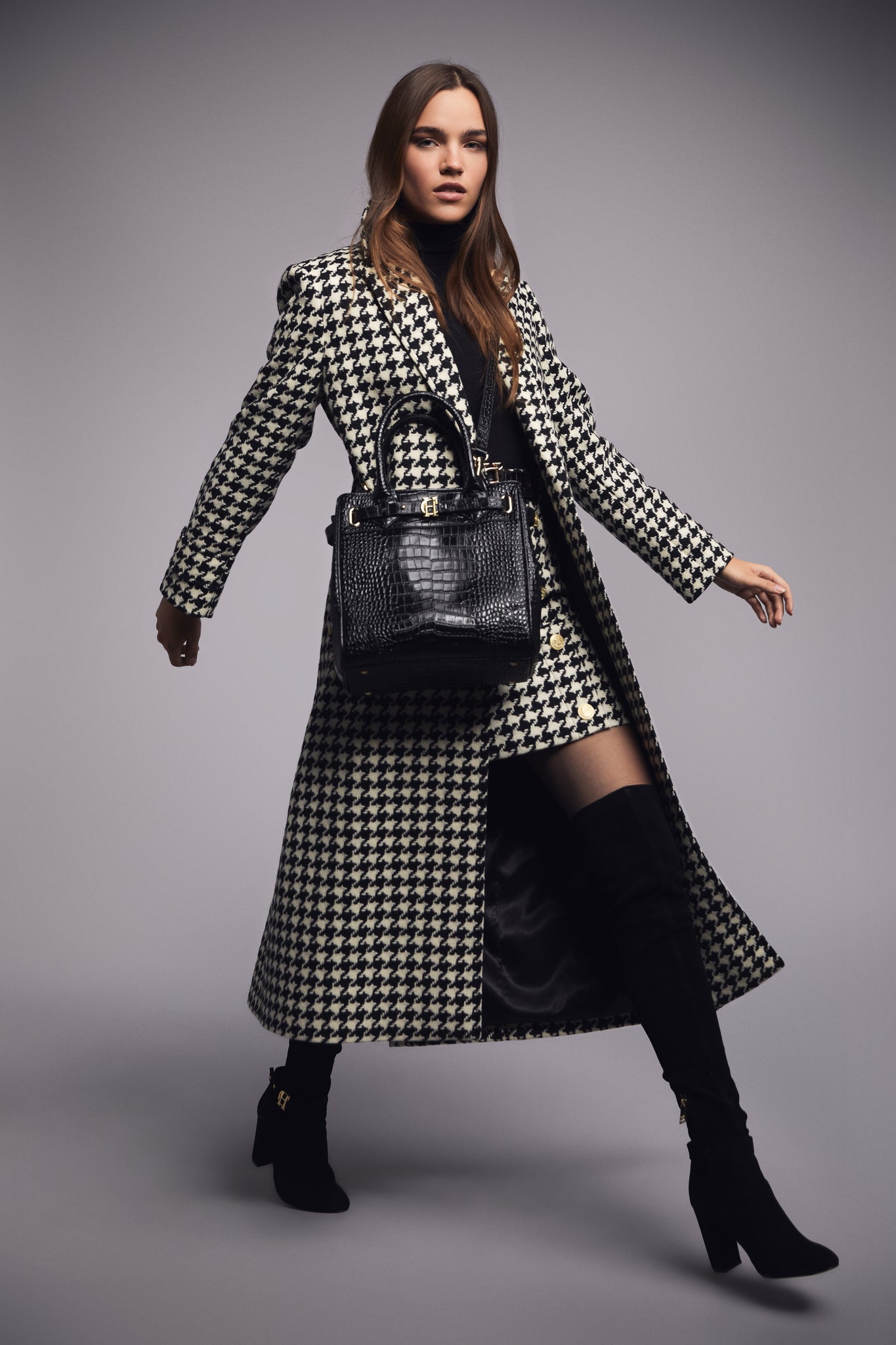 Womens black and white large houndstooth mid length wrap coat with tie belt and black croc embossed leather tote bag