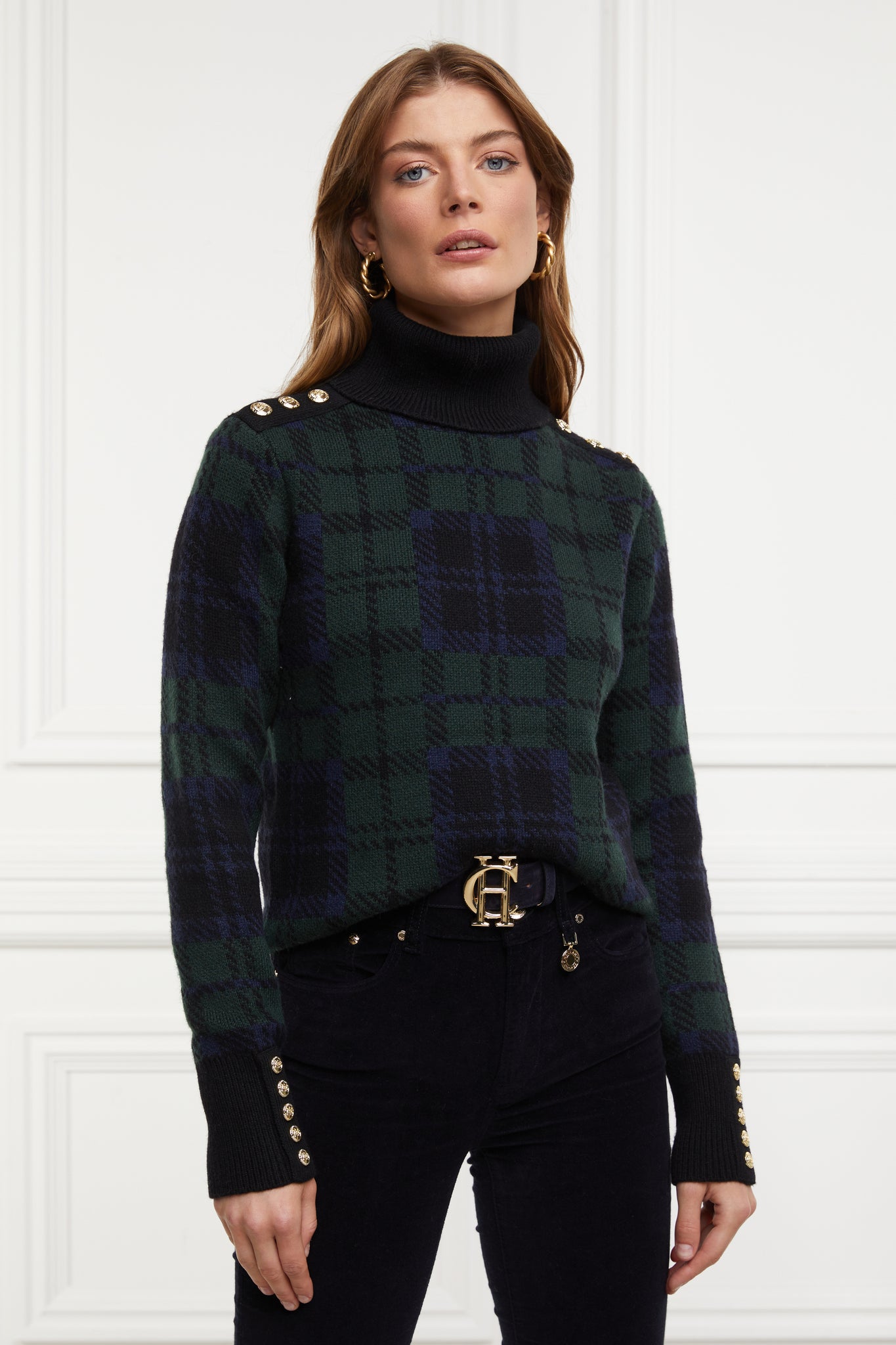 womens classic green navy and black blackwatch jumper with contrast black cuffs, roll neck and split ribbed hem with gold button detail on the cuffs and collar