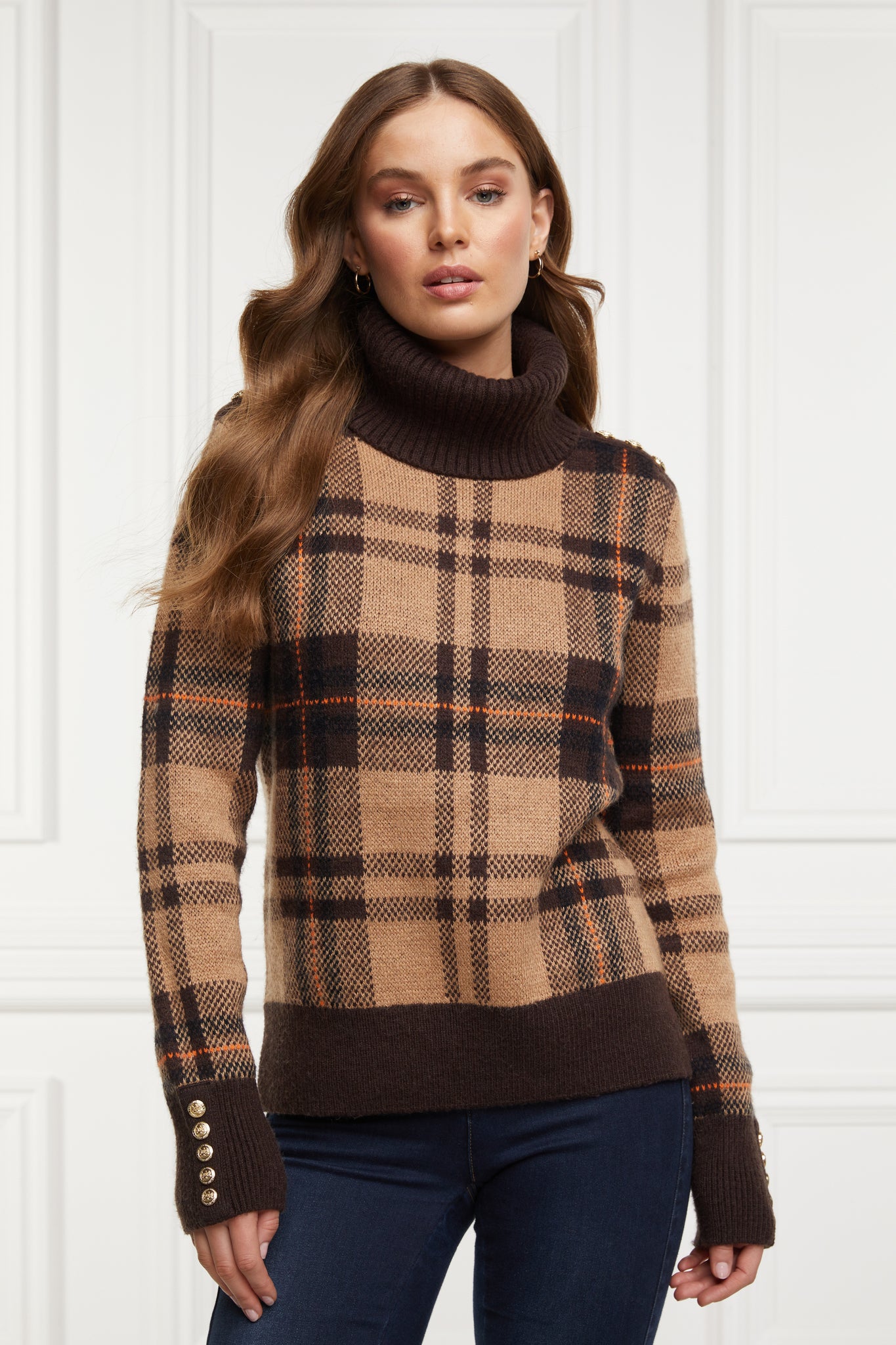 a classic camel check jumper with contrast brown cuffs, roll neck and split ribbed hem with gold button detail on the cuffs and collar