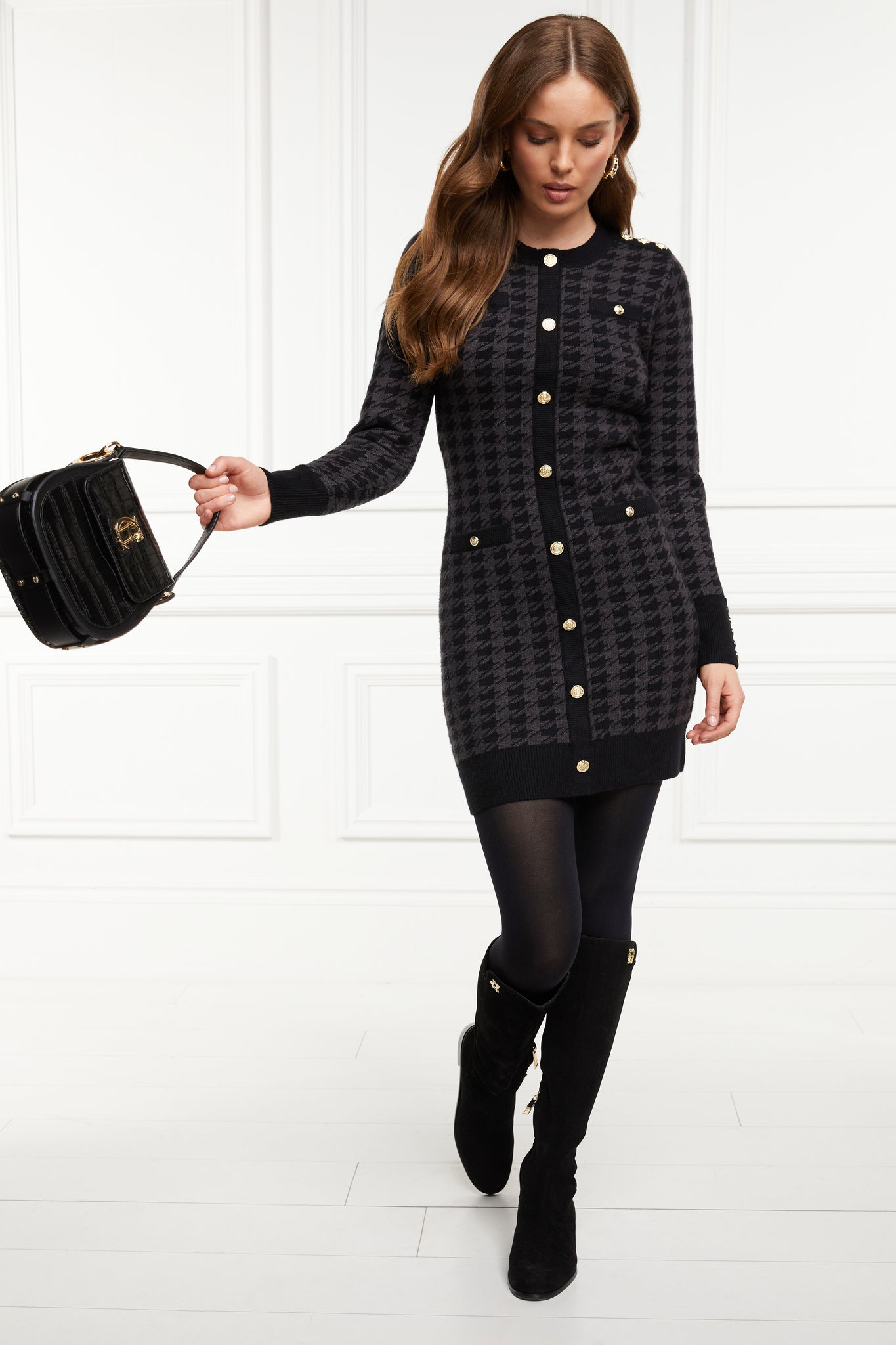 womens slim fit crew neck long sleeve knitted dress in grey and black houndstooth with gold button detail on contrast black panel down the centre front and two black contrast welt pockets on chest and two on the hips with gold buttons on the centre of each and contrasting black ribbed hem neckline and cuffs