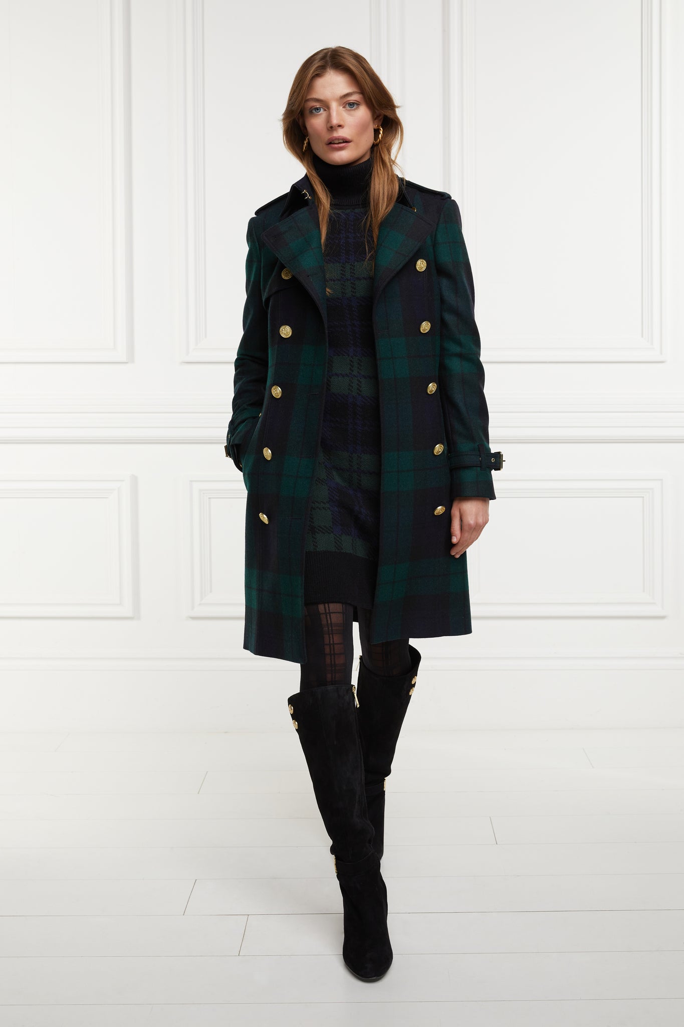 womens green navy and black blackwatch roll neck jumper dress with contrast black cuffs and ribbed hem with gold button detail on the cuffs and shoulder under blackwatch mid length trench coat