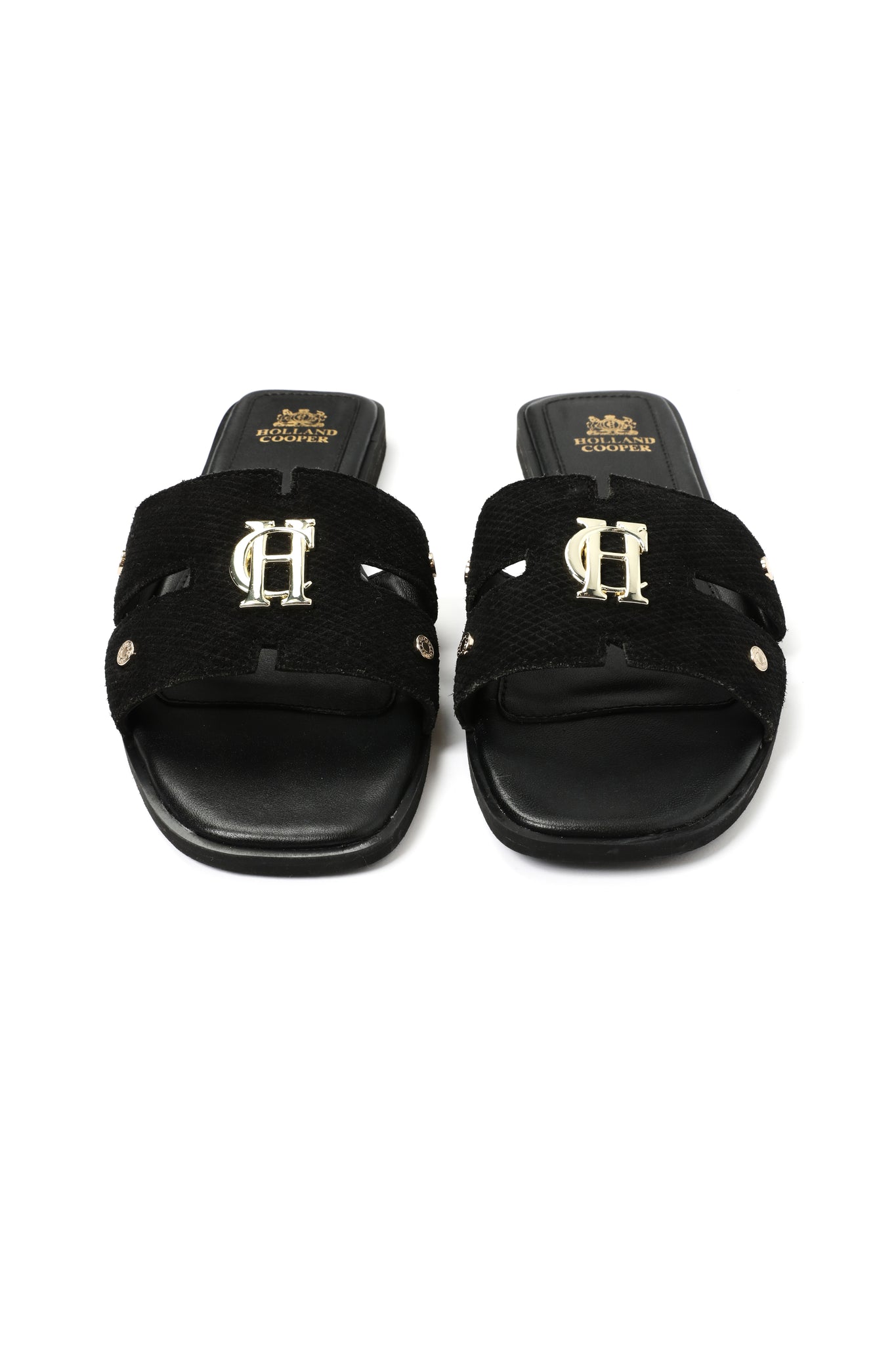 Front shot of black suede sliders with a black leather sole and gold hardware. 