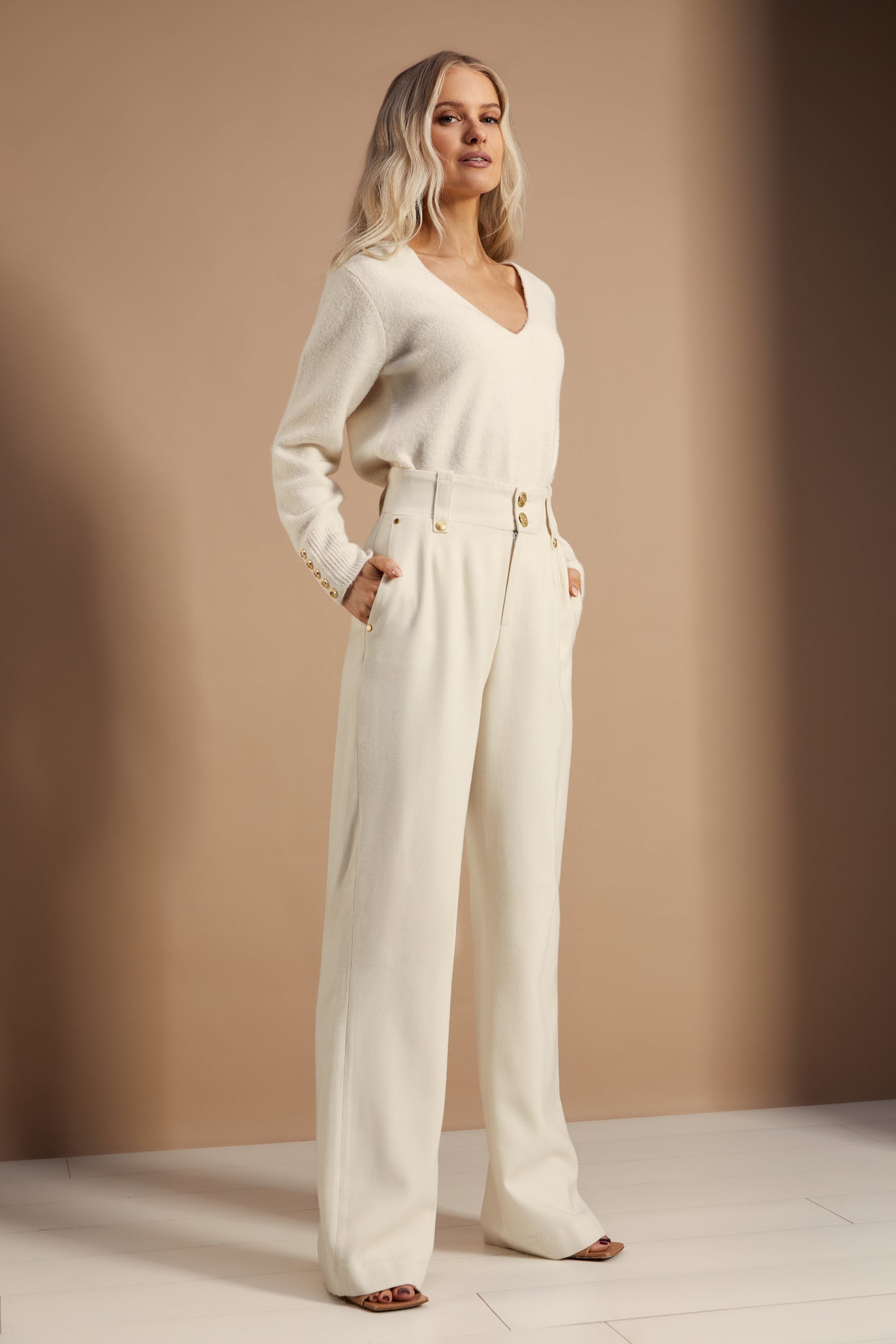 Women’s ivory wool high waisted straight trousers with wool v neck knitted top  