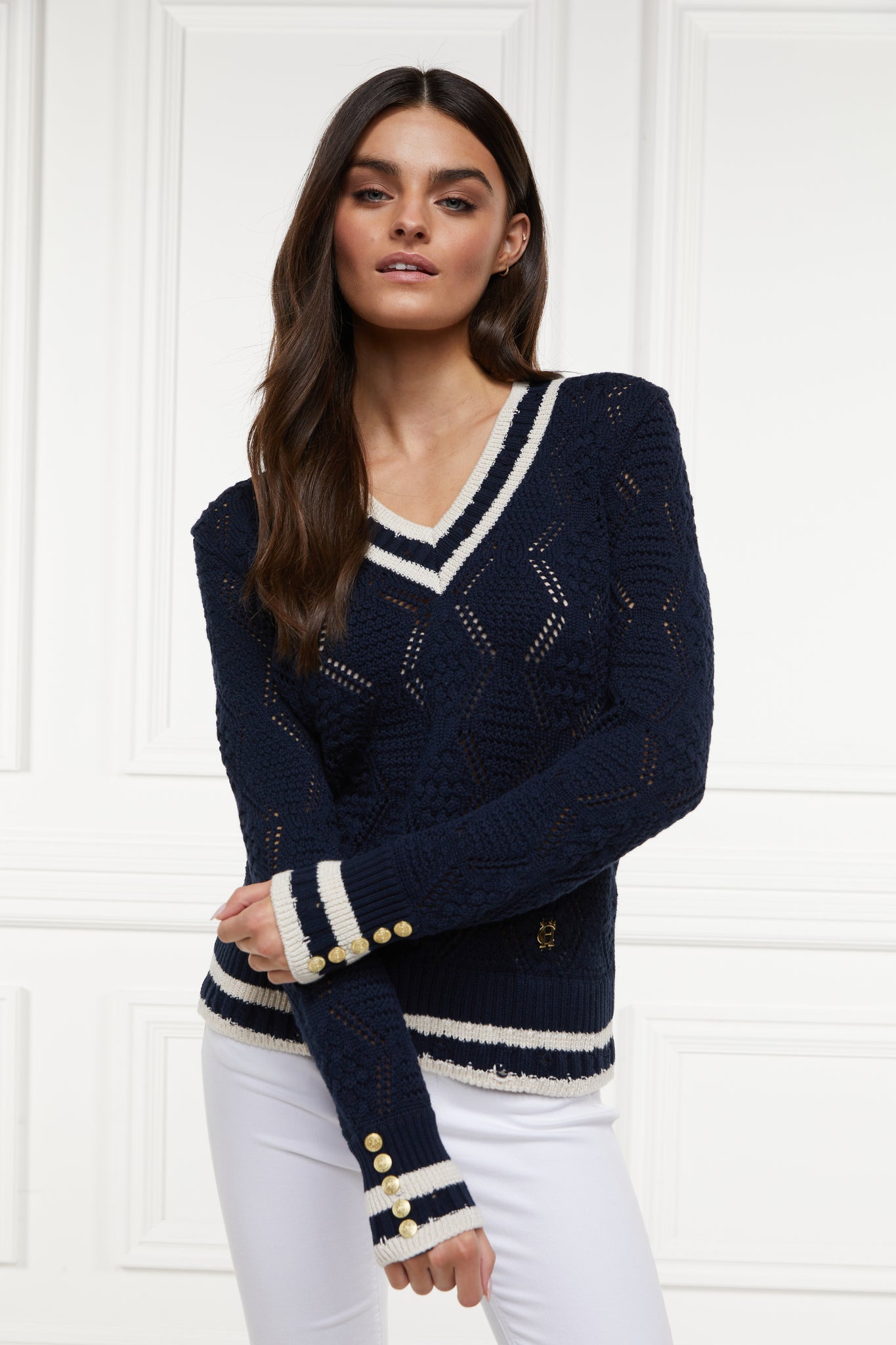 a cricket style v neck lightweight knit in navy with thick ribbed  cream double stripe trims on cuffs and neckline