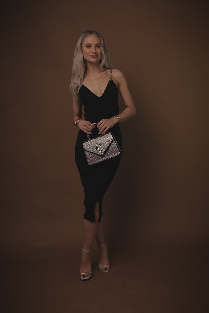 video of  womens black ribbed v neck midi dress with silver chain straps and silver diamante rhinestones bag