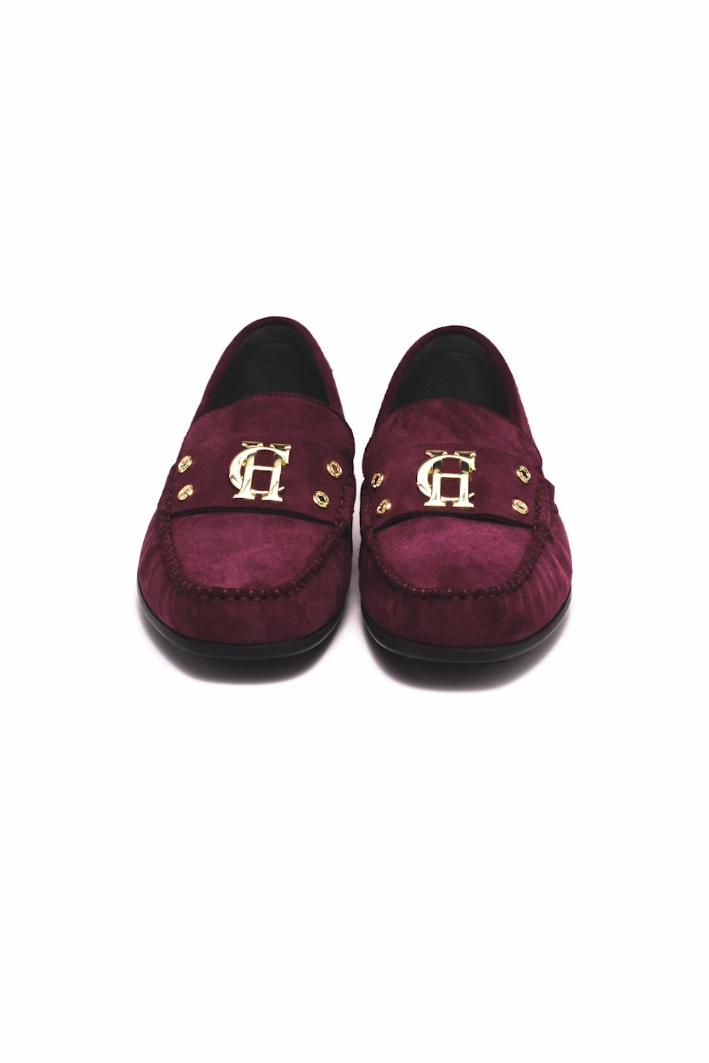 360 video of classic deep red suede loafers with a leather sole and top stitching details and gold hardware 