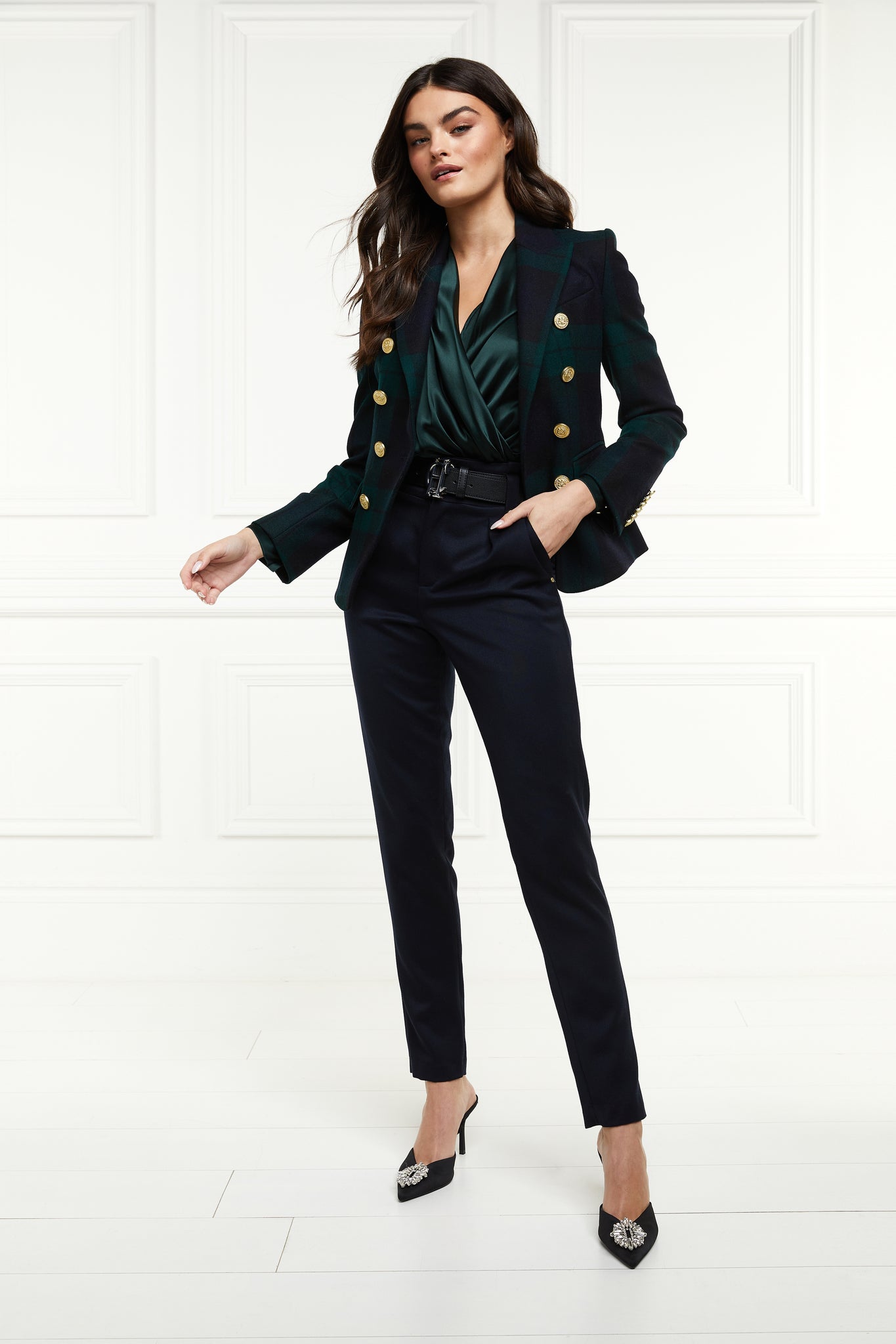 British made double breasted blazer that fastens with a single button hole to create a more form fitting silhouette with two pockets and gold button detailing this blazer is made from navy and green blackwatch tartan worn with emerald green silk shirt and black tailored trousers