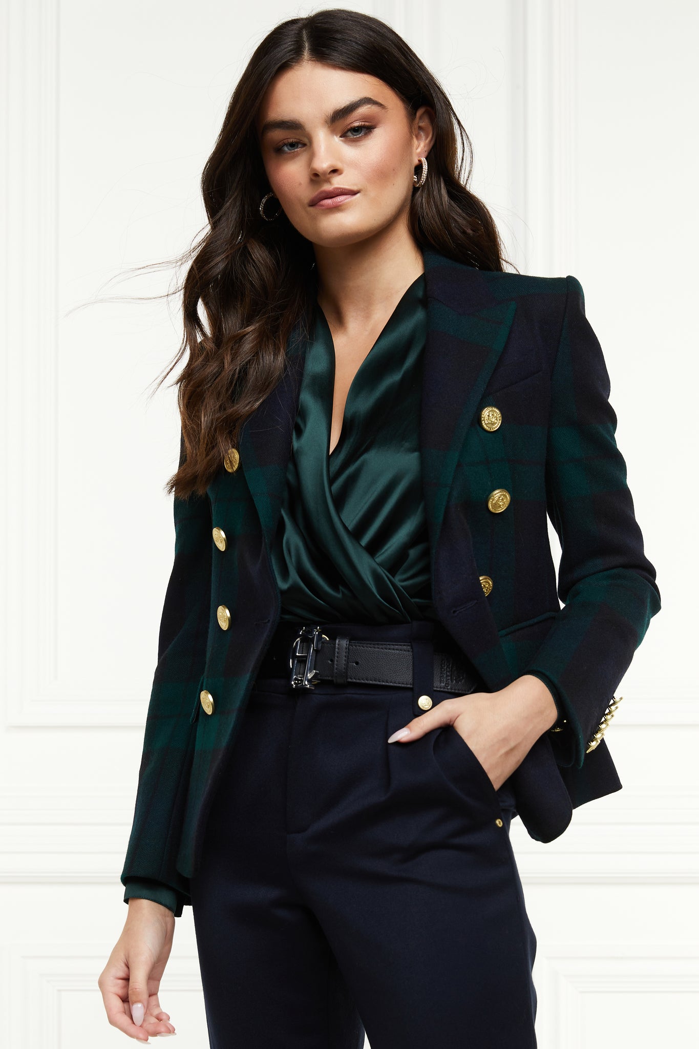 British made double breasted blazer that fastens with a single button hole to create a more form fitting silhouette with two pockets and gold button detailing this blazer is made from navy and green blackwatch tartan