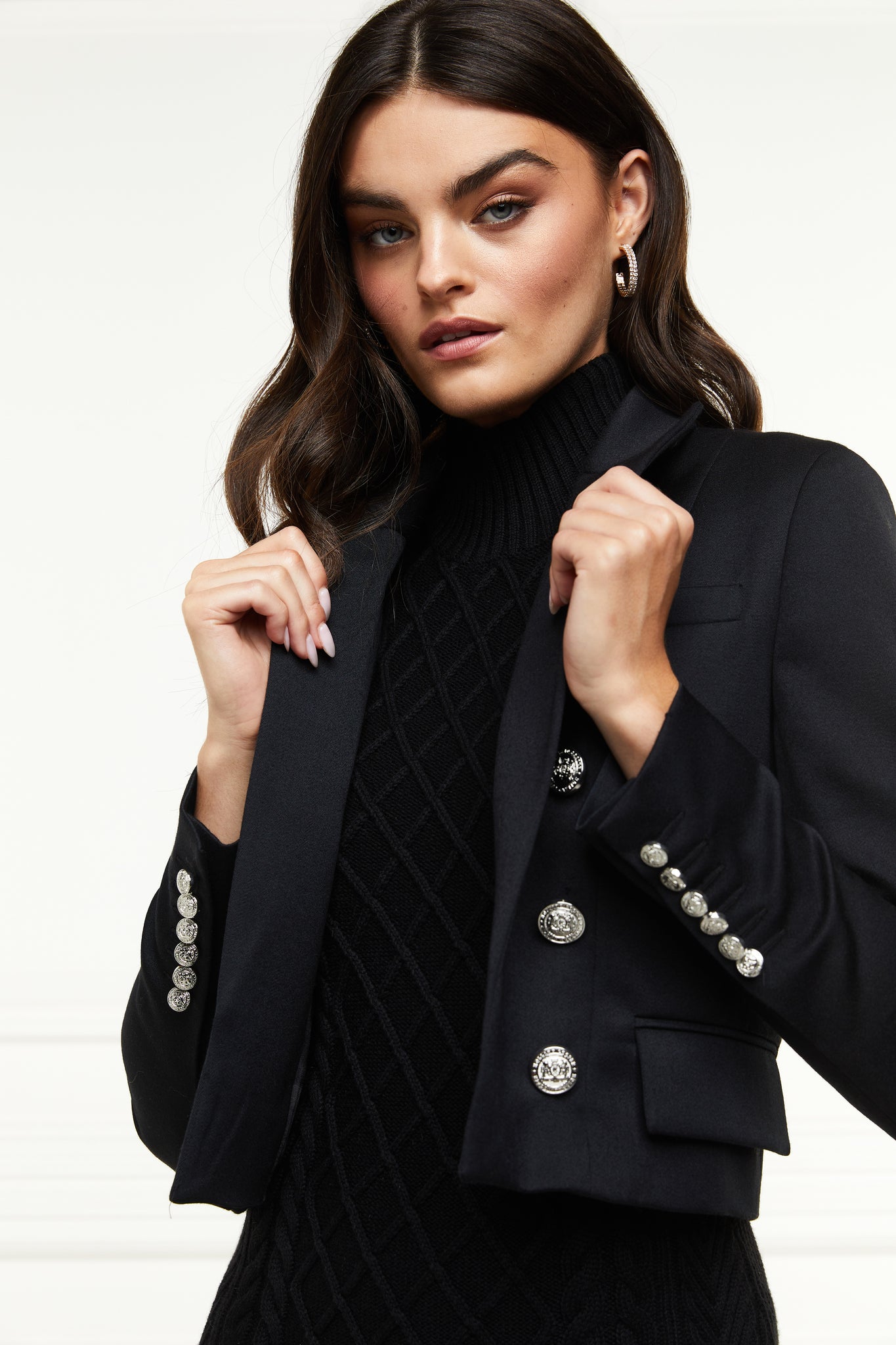 British made tailored cropped jacket in black with welt pockets and gold button detail down the front and on sleeves
