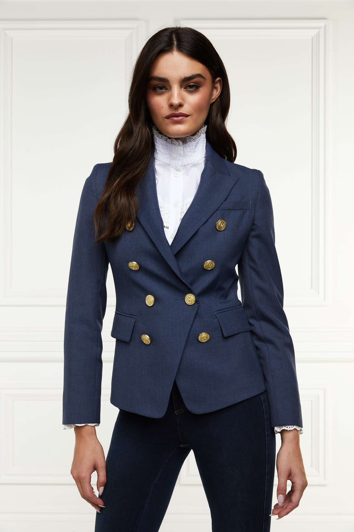 British made double breasted blazer that fastens with a single button hole to create a more form fitting silhouette with two pockets and gold button detailing this blazer in denim 