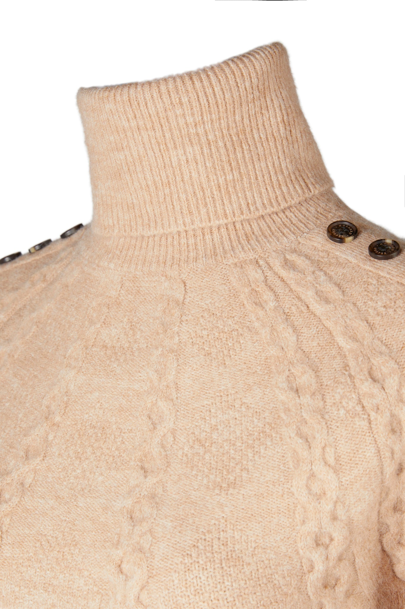 roll neck detail of chunky knit roll neck jumper in camel with textured knit detailing and horn buttons across both shoulders