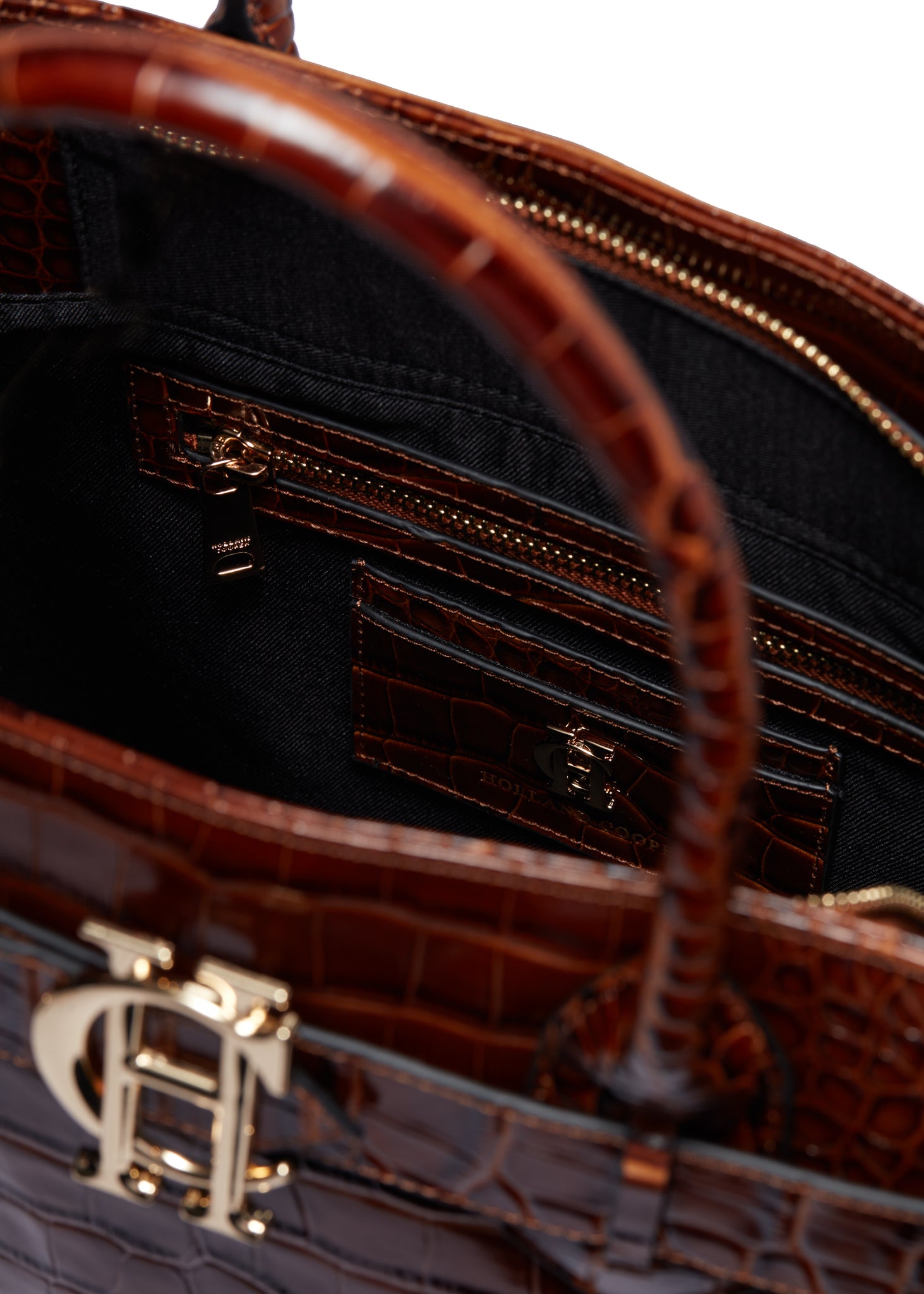 inside card holder and internal zip pocket of dark brown croc embossed leather tote bag