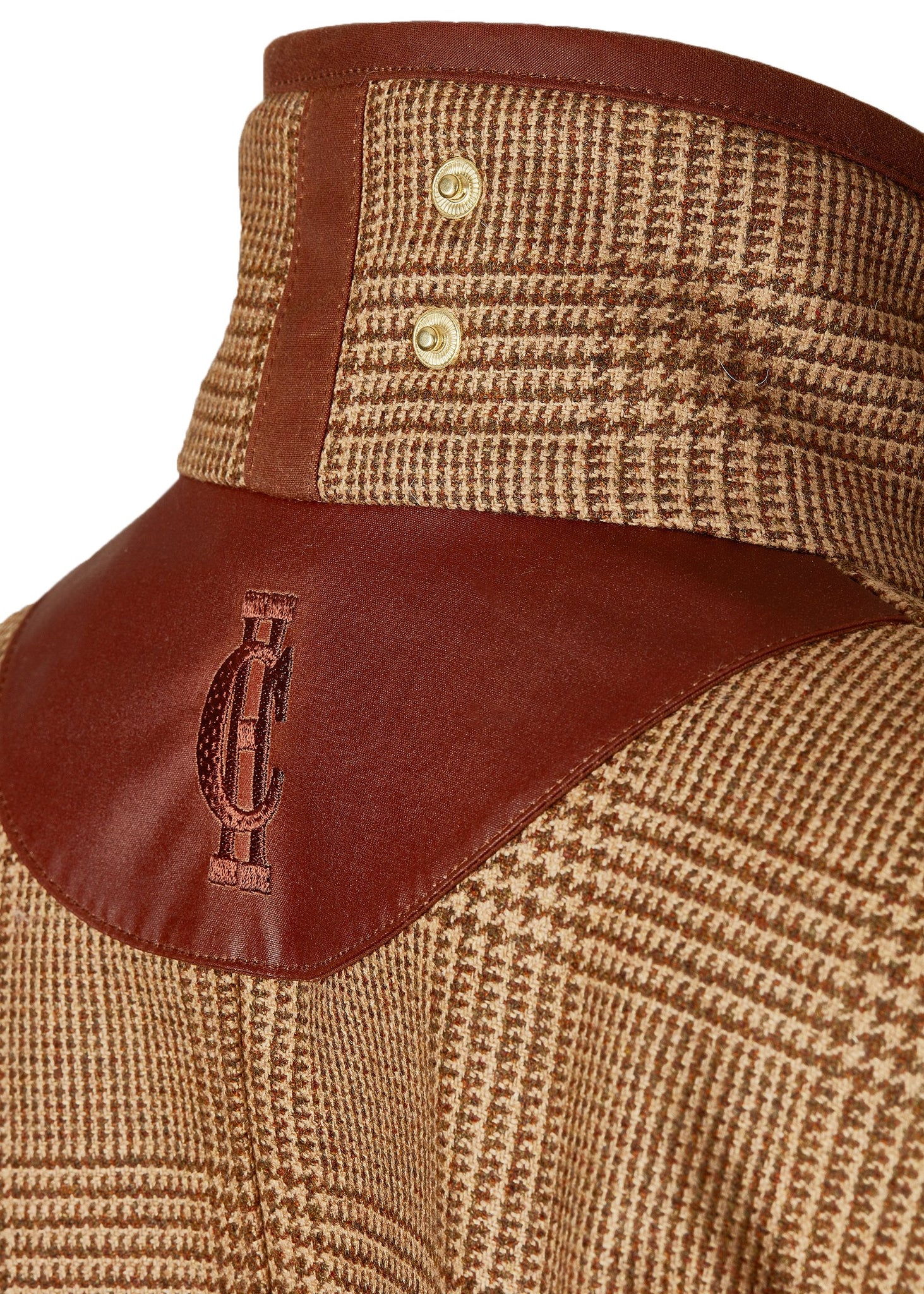 Back collar shot of tan brown tartan tweed field coat