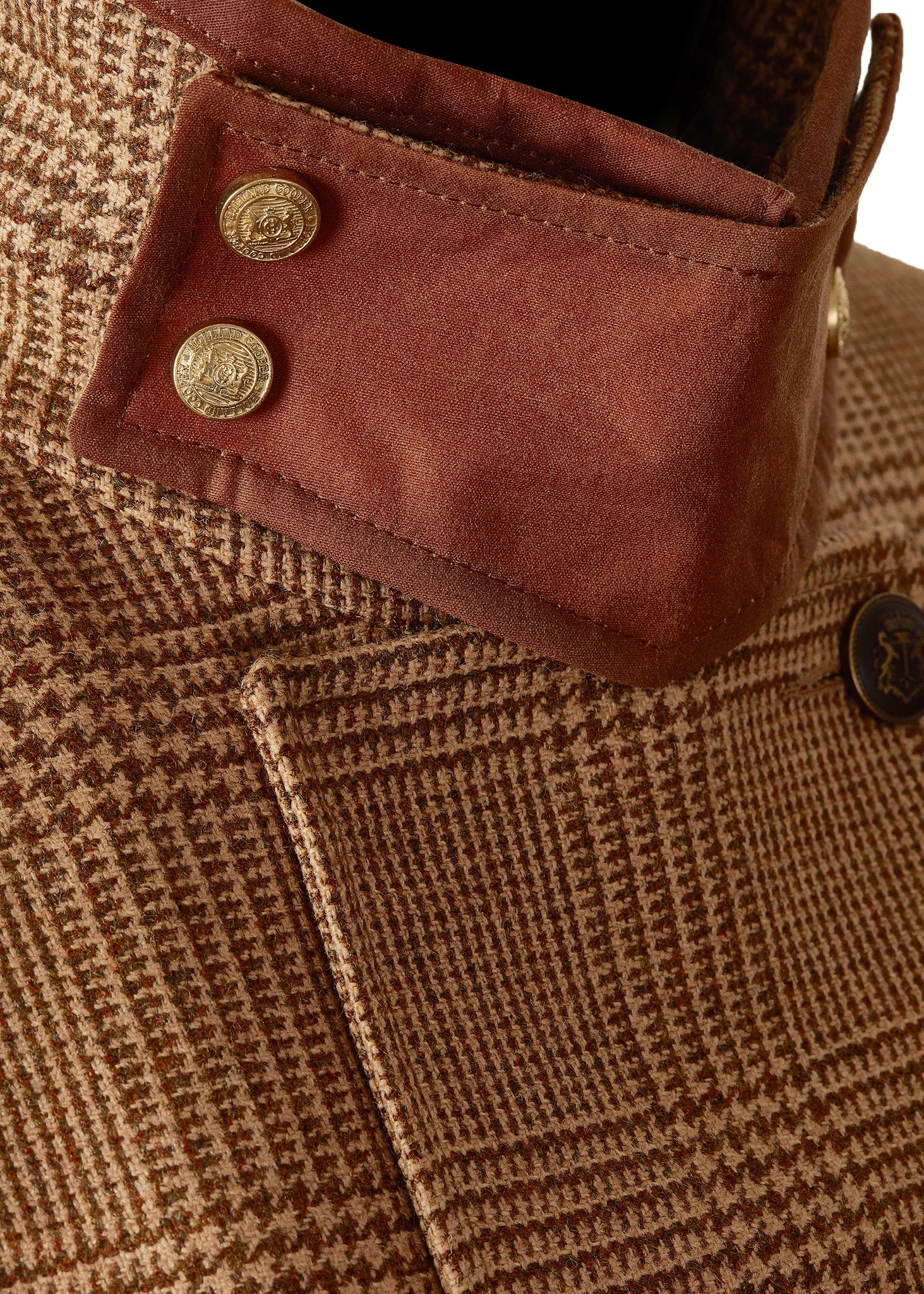 Detail collar of tan brown tartan tweed field coat