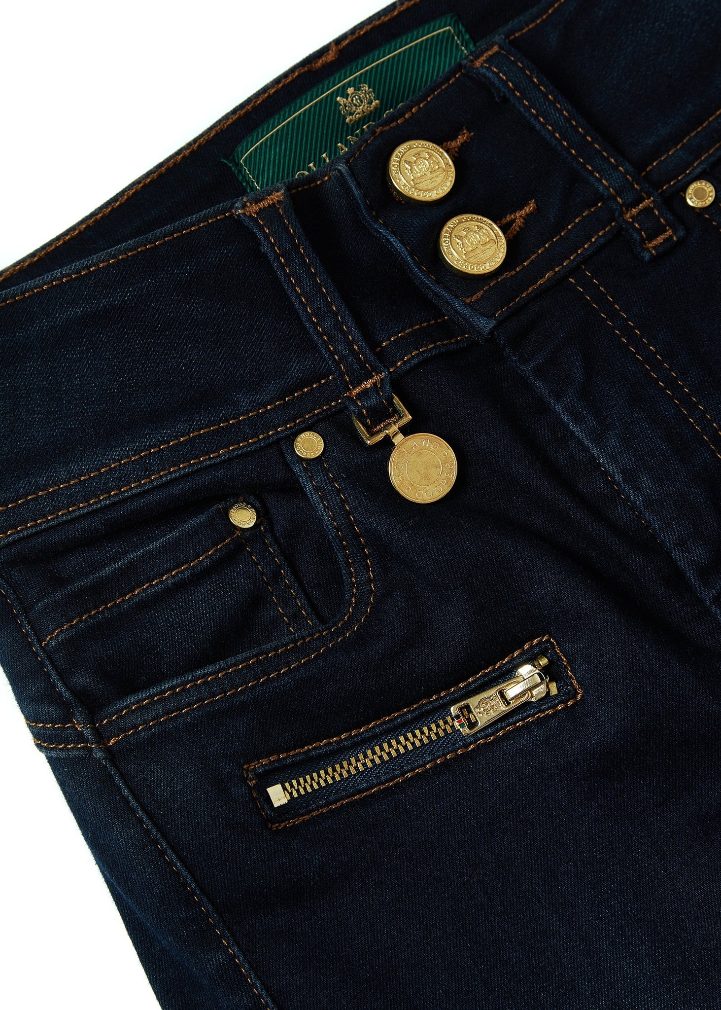 front pocket detail on womens high rise dark blue skinny stretch jean with pin tuck biker panels to front and two open zip pockets on front with HC embroidery to left pocket facing