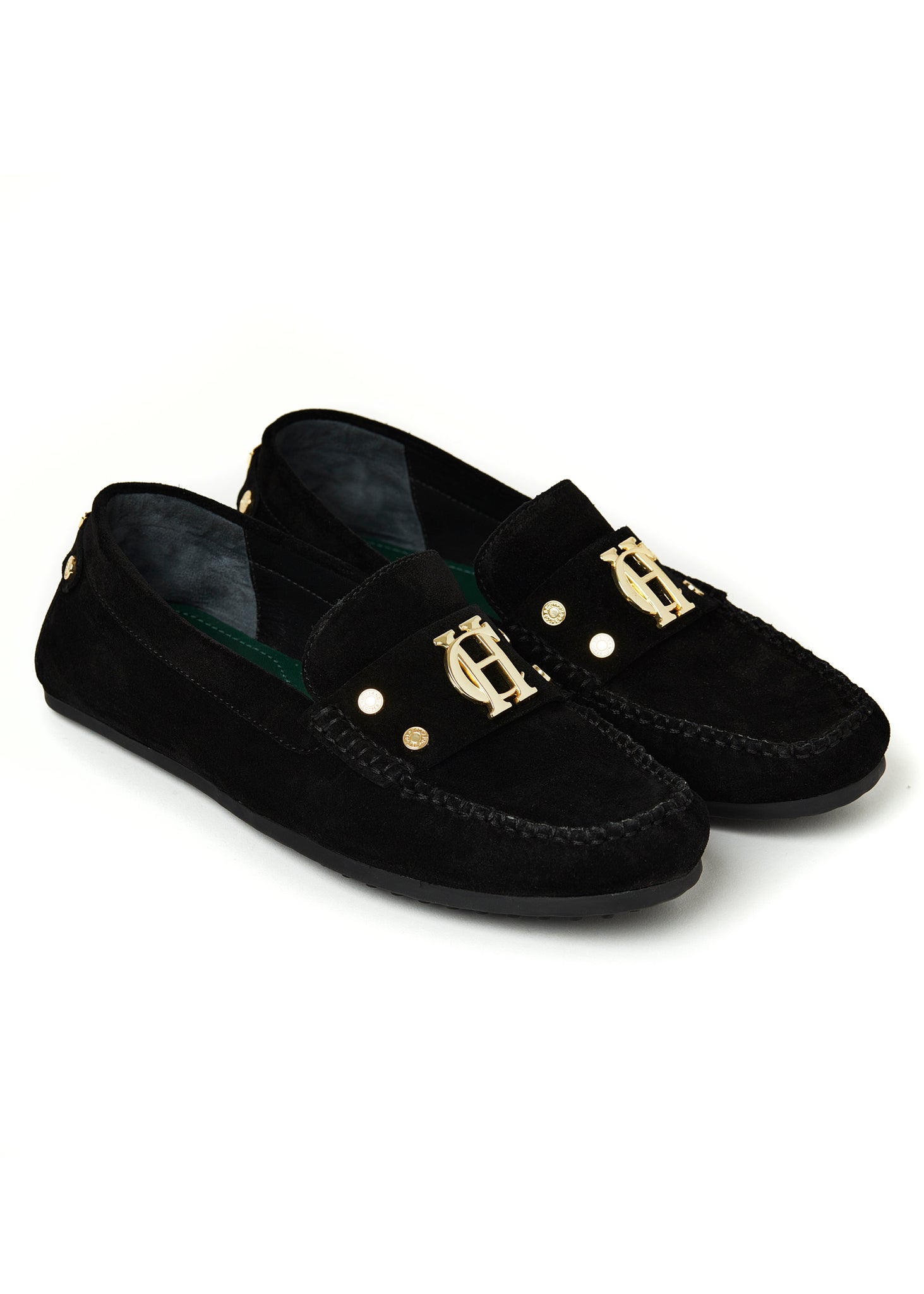 classic black suede loafers with a leather sole and top stitching details and gold hardware and dark green inner sole