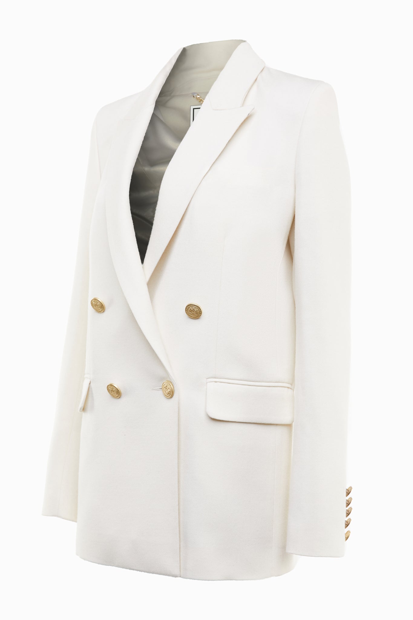 longline double breasted wool blazer in ivory tailor made in britain with relaxed fit welt pockets and gold buttons on the front and cuffs