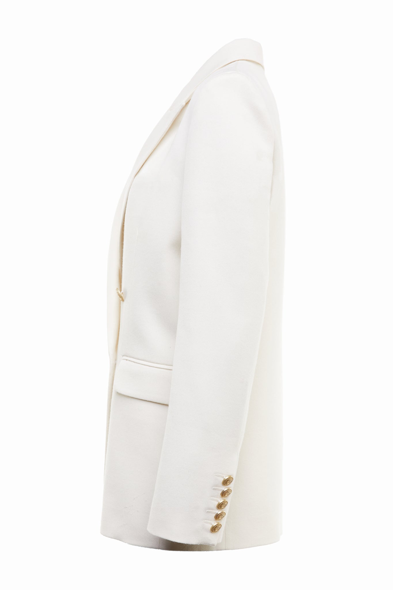side of longline double breasted wool blazer in ivory tailor made in britain with relaxed fit welt pockets and gold buttons on the front and cuffs