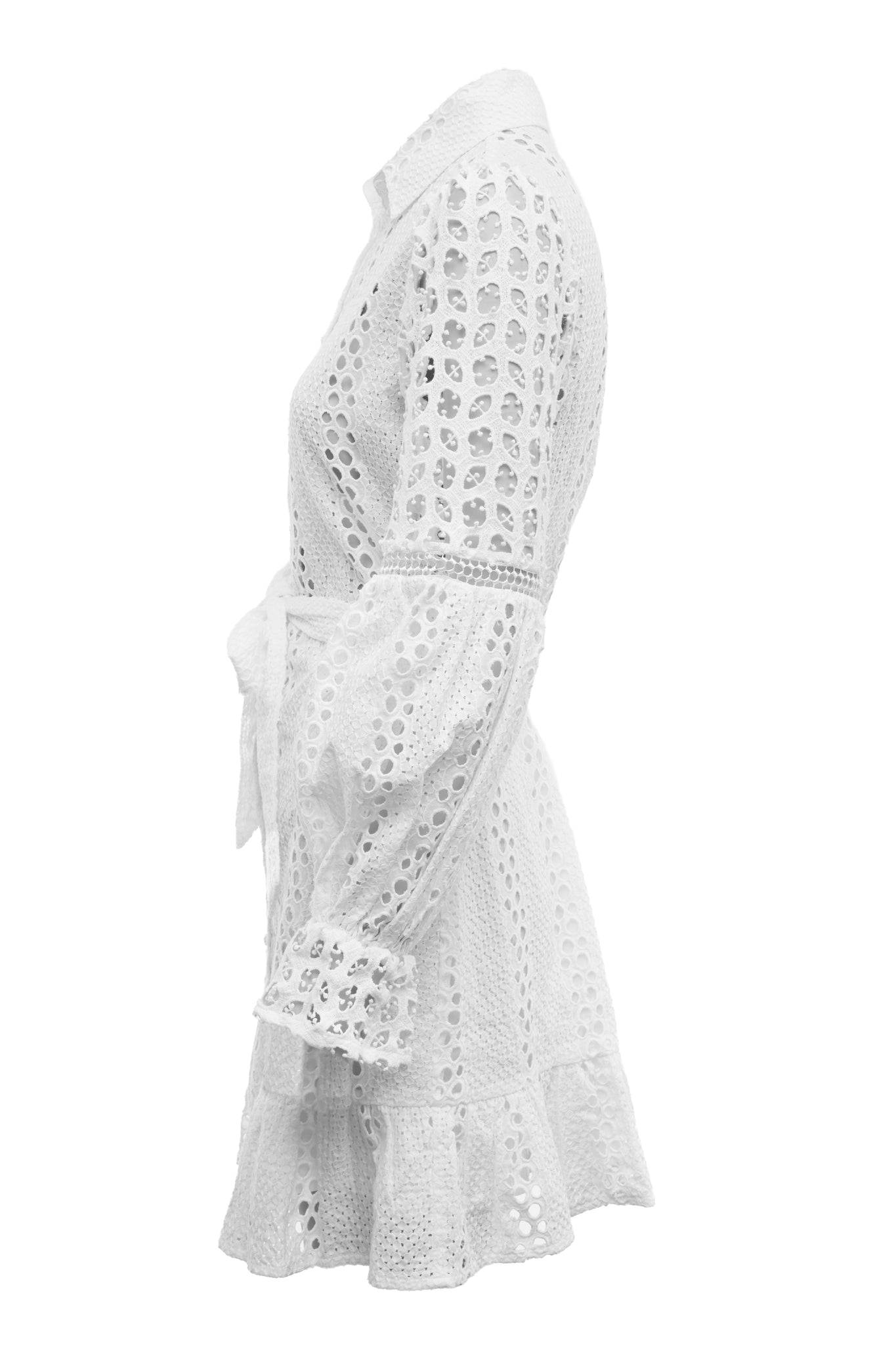 Side shot of womens white mini dress in broderie lace with a tie around waist 
