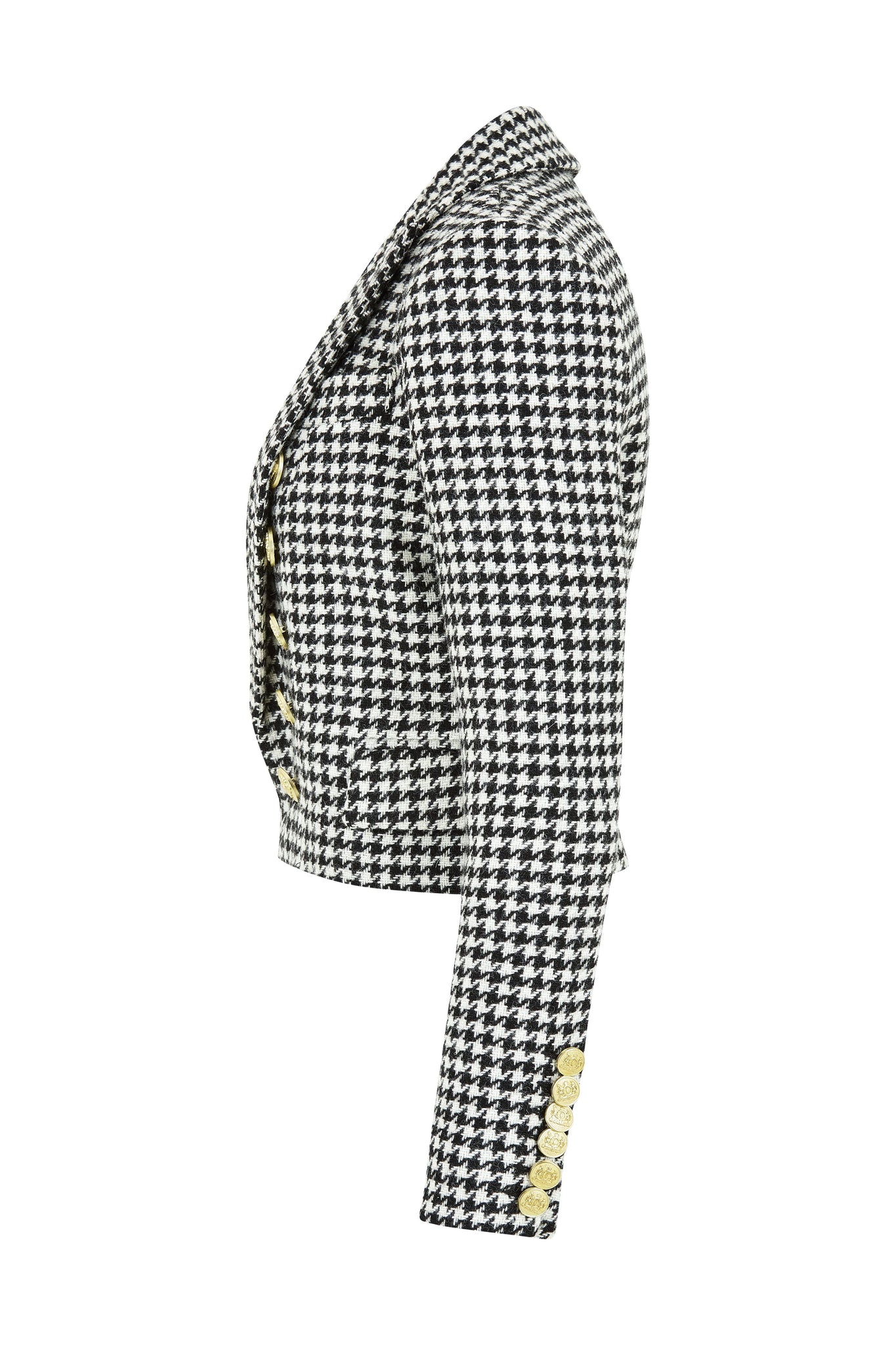 side of British made tailored cropped jacket in black and white houndstooth with welt pockets and gold button detail down the front and on sleeves