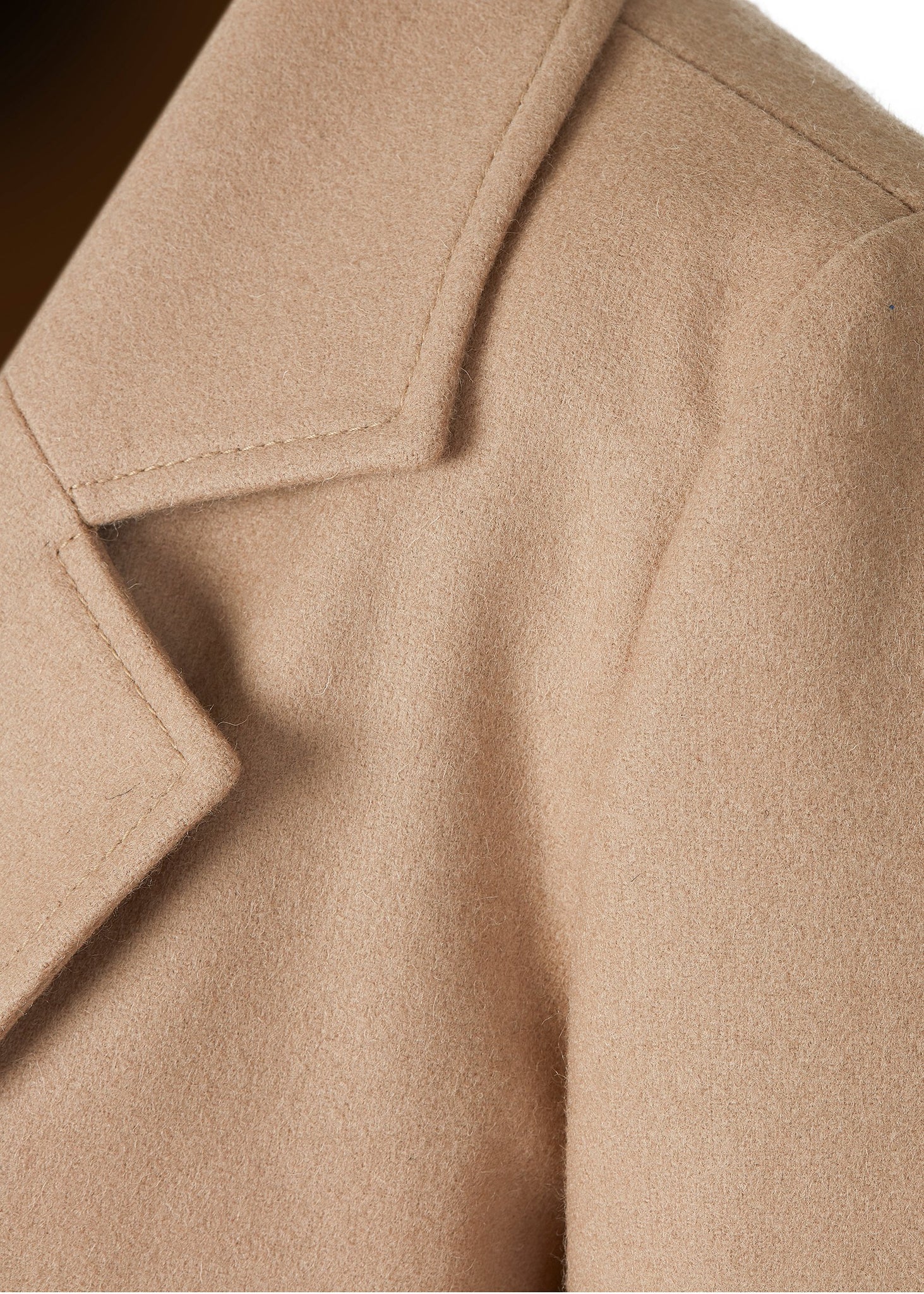 Collar detail of Womens camel wool double breasted mid-length tweed coat 