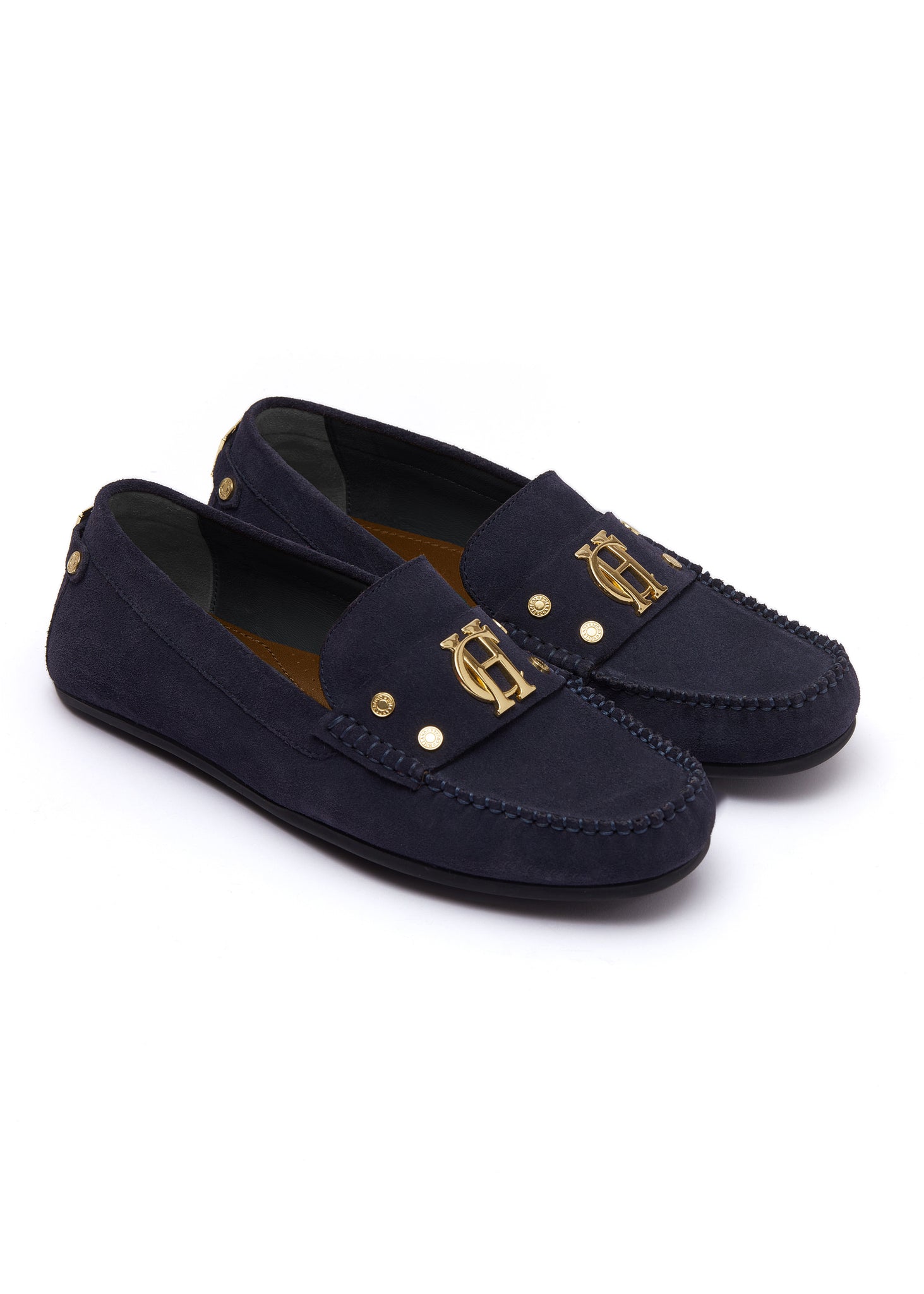 navy suede loafers with a leather sole and top stitching details and gold hardware