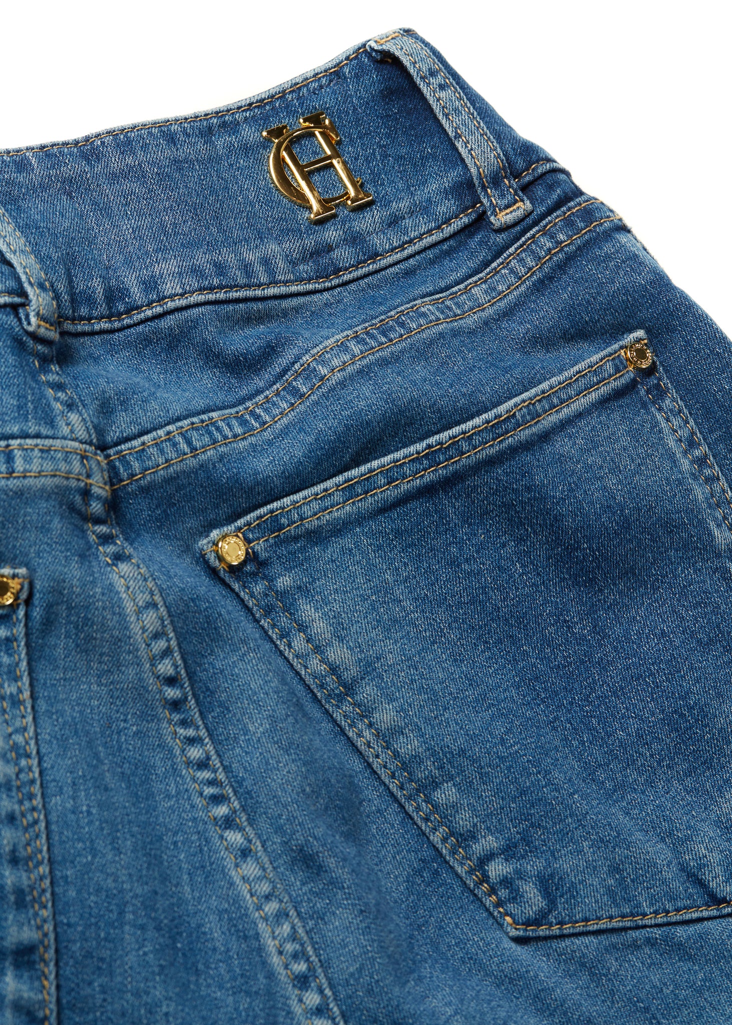 back pocket detail on womens high rise blue denim flared jean with centre front zip fly fastening with two open pockets at the front and back and gold hardware on back waistband