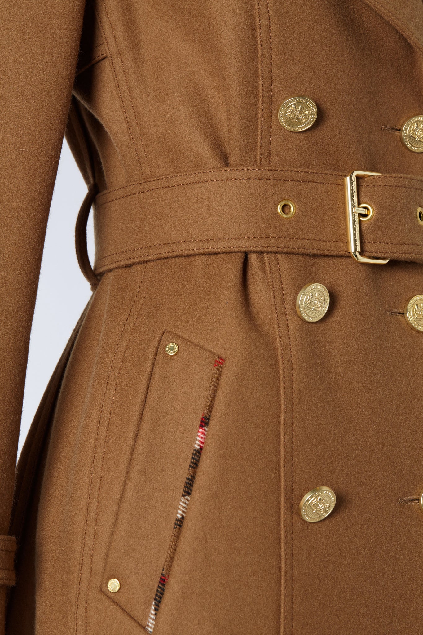 belt and pocket detail of womens dark camel wool double breasted trench coat