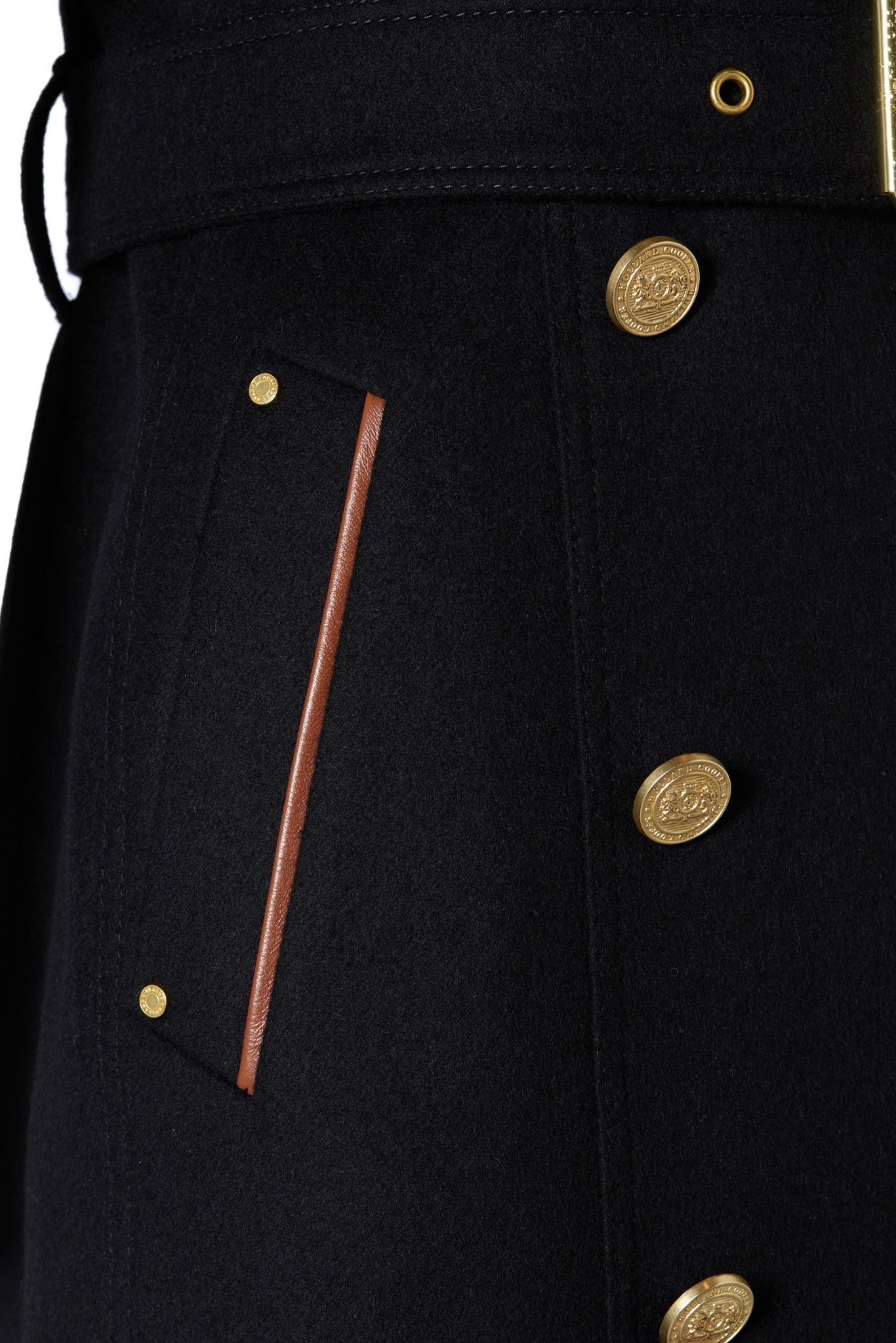 Tan leather pipping detail on pocket on womens black wool and tan leather double breasted full length trench coat 